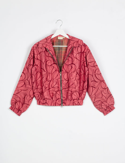 Stylish BOMBER JACKET, an upcycled clothing masterpiece with a cute cropped shape, elasticated details, and detachable metallic zipper. Contrast sari print lining adds a unique touch. Explore sustainable and eco-friendly fashion.