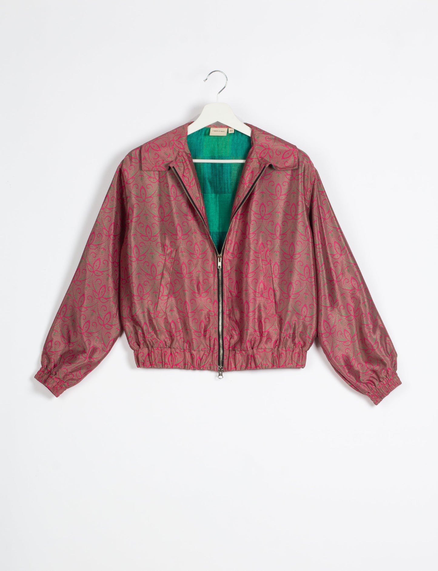 Stylish BOMBER JACKET, an upcycled clothing masterpiece with a cute cropped shape, elasticated details, and detachable metallic zipper. Contrast sari print lining adds a unique touch. Explore sustainable and eco-friendly fashion.