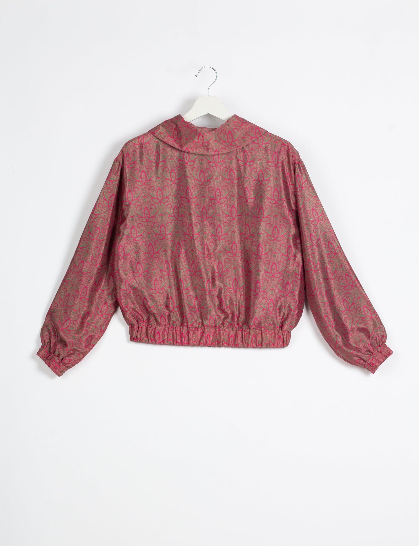 Stylish BOMBER JACKET, an upcycled clothing masterpiece with a cute cropped shape, elasticated details, and detachable metallic zipper. Contrast sari print lining adds a unique touch. Explore sustainable and eco-friendly fashion.