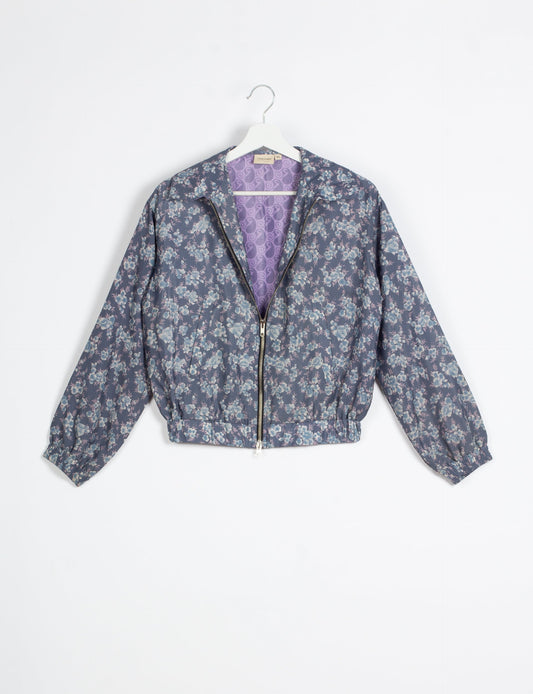 Stylish BOMBER JACKET, an upcycled clothing masterpiece with a cute cropped shape, elasticated details, and detachable metallic zipper. Contrast sari print lining adds a unique touch. Explore sustainable and eco-friendly fashion.