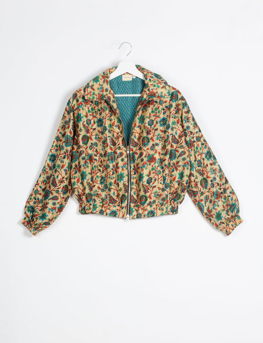 Stylish BOMBER JACKET, an upcycled clothing masterpiece with a cute cropped shape, elasticated details, and detachable metallic zipper. Contrast sari print lining adds a unique touch. Explore sustainable and eco-friendly fashion.