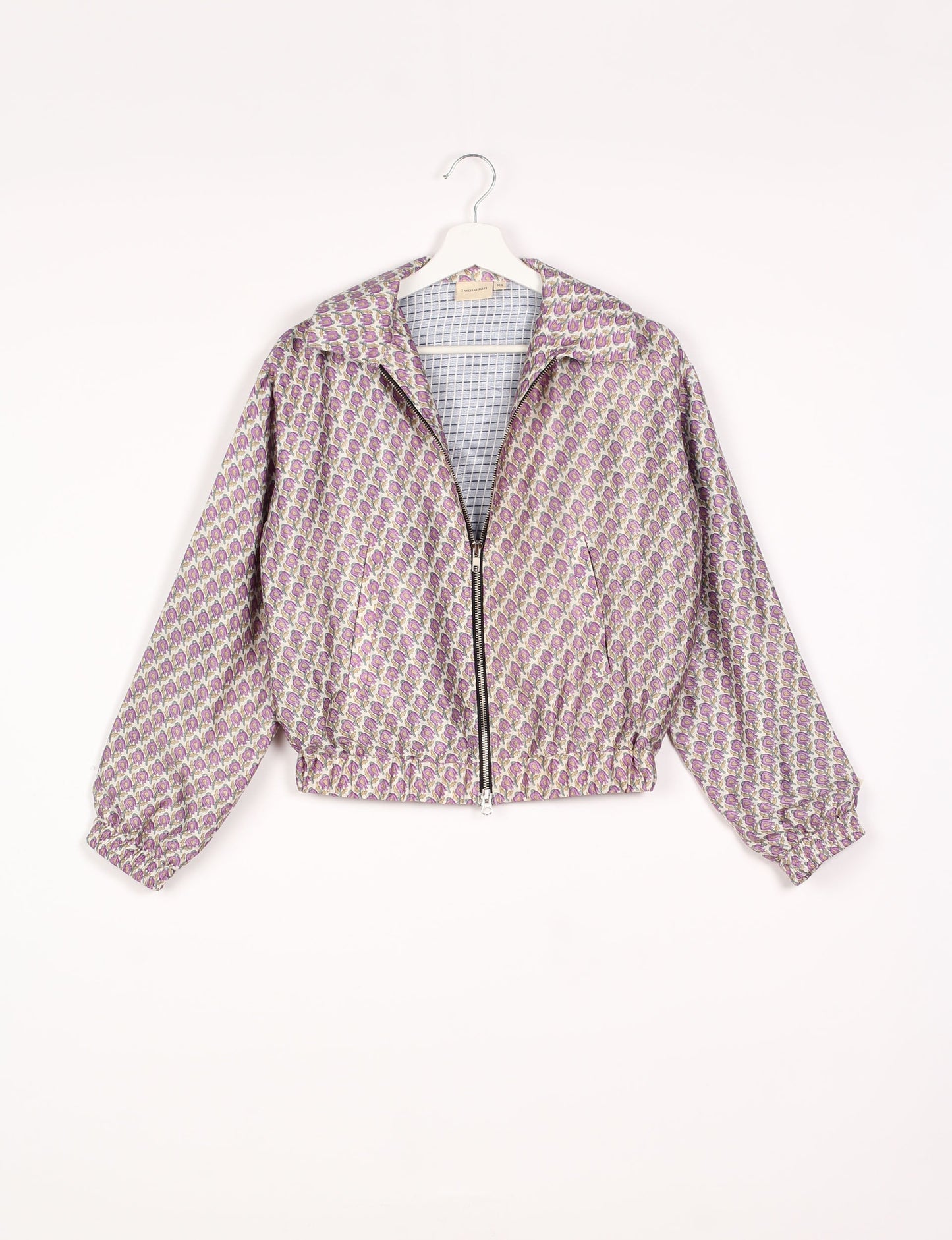 Stylish BOMBER JACKET, an upcycled clothing masterpiece with a cute cropped shape, elasticated details, and detachable metallic zipper. Contrast sari print lining adds a unique touch. Explore sustainable and eco-friendly fashion.