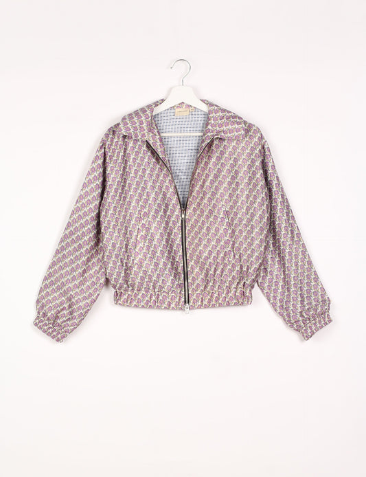 Stylish BOMBER JACKET, an upcycled clothing masterpiece with a cute cropped shape, elasticated details, and detachable metallic zipper. Contrast sari print lining adds a unique touch. Explore sustainable and eco-friendly fashion.