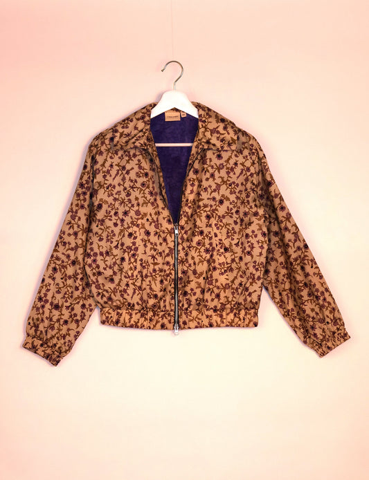 Stylish BOMBER JACKET, an upcycled clothing masterpiece with a cute cropped shape, elasticated details, and detachable metallic zipper. Contrast sari print lining adds a unique touch. Explore sustainable and eco-friendly fashion.