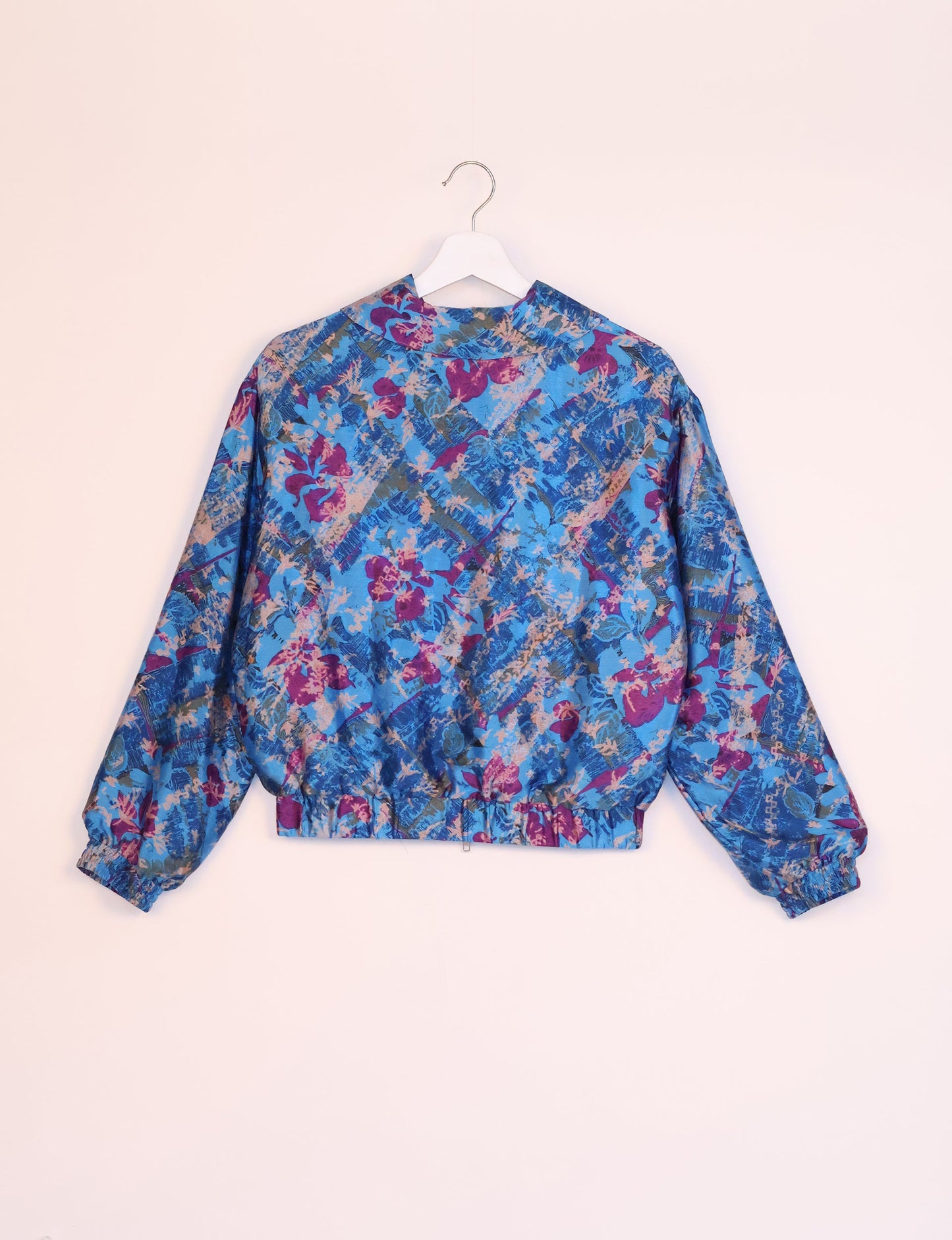 Stylish BOMBER JACKET, an upcycled clothing masterpiece with a cute cropped shape, elasticated details, and detachable metallic zipper. Contrast sari print lining adds a unique touch. Explore sustainable and eco-friendly fashion.