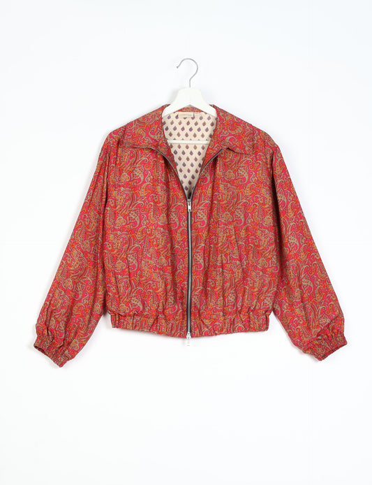 Stylish BOMBER JACKET, an upcycled clothing masterpiece with a cute cropped shape, elasticated details, and detachable metallic zipper. Contrast sari print lining adds a unique touch. Explore sustainable and eco-friendly fashion.