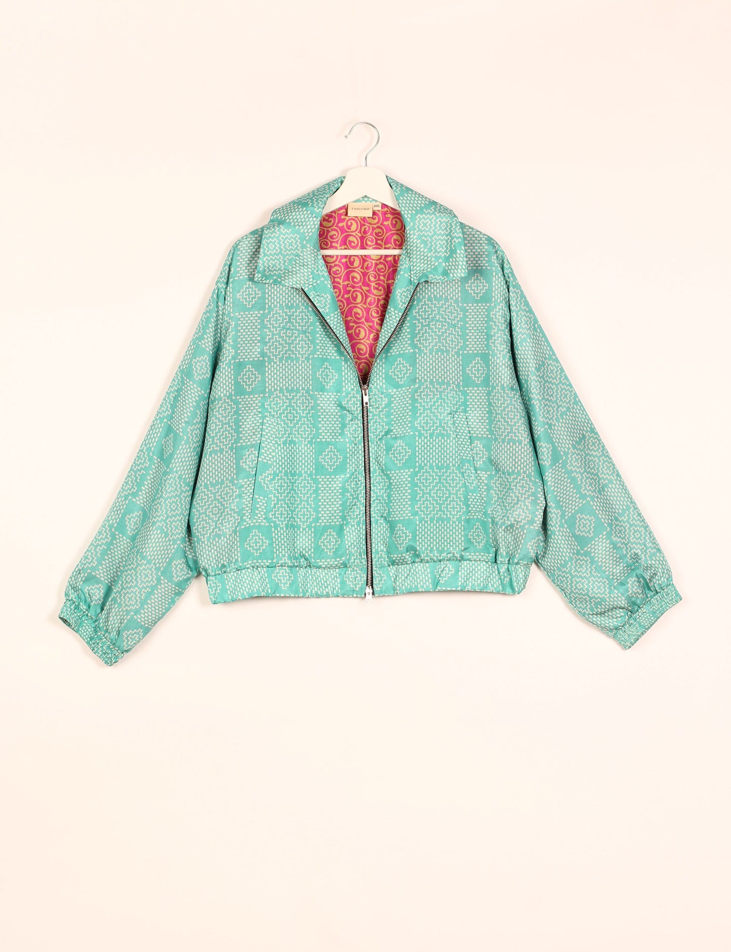 Stylish BOMBER JACKET, an upcycled clothing masterpiece with a cute cropped shape, elasticated details, and detachable metallic zipper. Contrast sari print lining adds a unique touch. Explore sustainable and eco-friendly fashion.