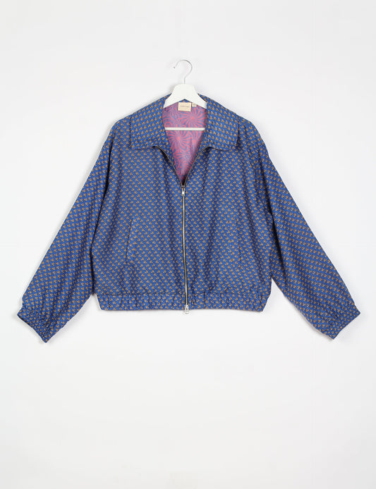 Stylish BOMBER JACKET, an upcycled clothing masterpiece with a cute cropped shape, elasticated details, and detachable metallic zipper. Contrast sari print lining adds a unique touch. Explore sustainable and eco-friendly fashion.