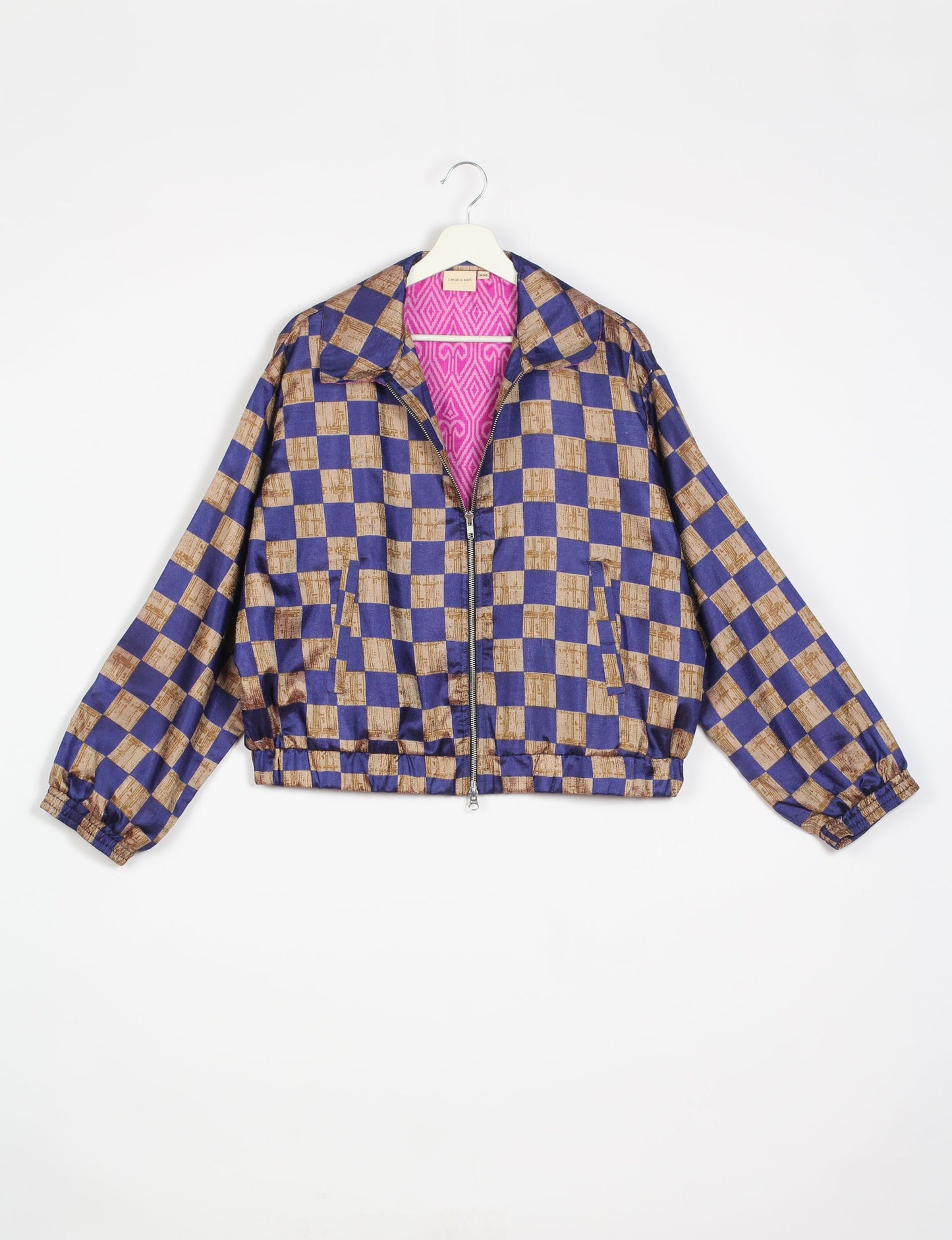 Stylish BOMBER JACKET, an upcycled clothing masterpiece with a cute cropped shape, elasticated details, and detachable metallic zipper. Contrast sari print lining adds a unique touch. Explore sustainable and eco-friendly fashion.