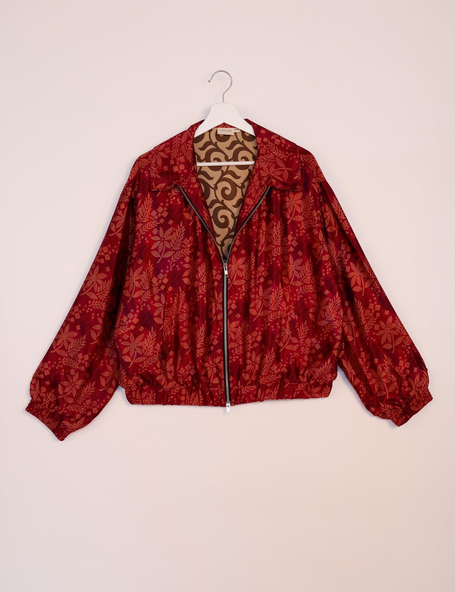 Stylish BOMBER JACKET, an upcycled clothing masterpiece with a cute cropped shape, elasticated details, and detachable metallic zipper. Contrast sari print lining adds a unique touch. Explore sustainable and eco-friendly fashion.