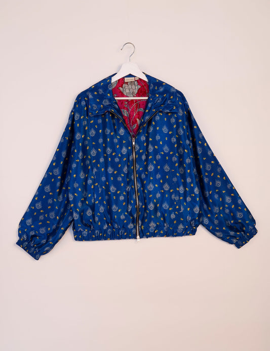 Stylish BOMBER JACKET, an upcycled clothing masterpiece with a cute cropped shape, elasticated details, and detachable metallic zipper. Contrast sari print lining adds a unique touch. Explore sustainable and eco-friendly fashion.