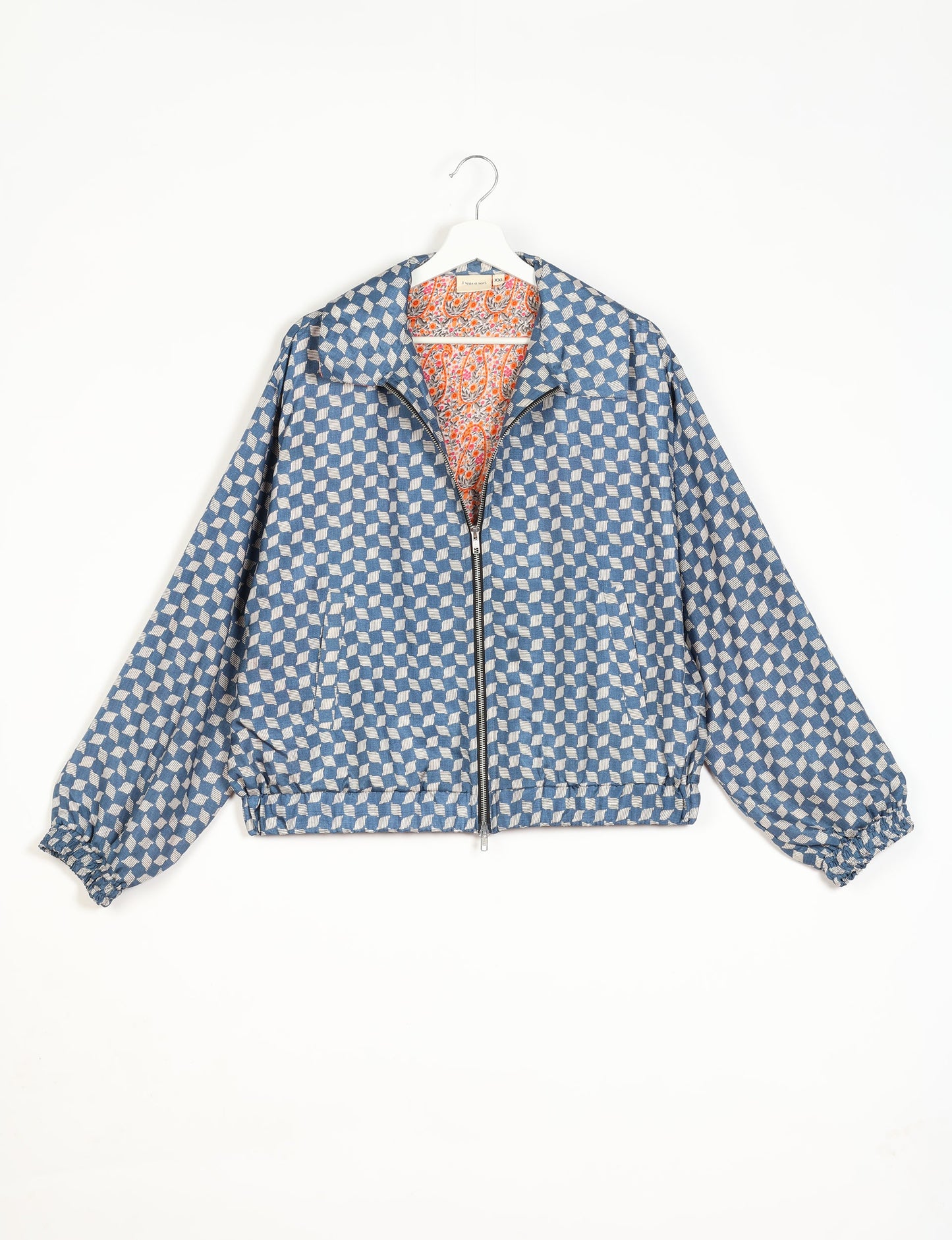 Stylish BOMBER JACKET, an upcycled clothing masterpiece with a cute cropped shape, elasticated details, and detachable metallic zipper. Contrast sari print lining adds a unique touch. Explore sustainable and eco-friendly fashion.