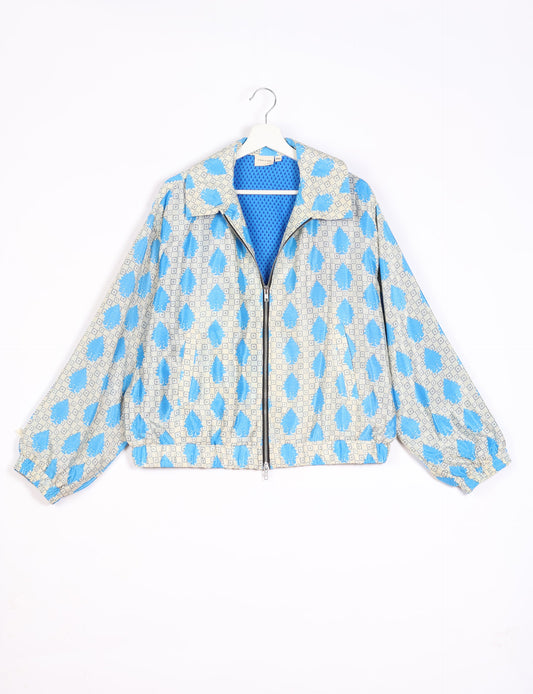 Stylish BOMBER JACKET, an upcycled clothing masterpiece with a cute cropped shape, elasticated details, and detachable metallic zipper. Contrast sari print lining adds a unique touch. Explore sustainable and eco-friendly fashion.