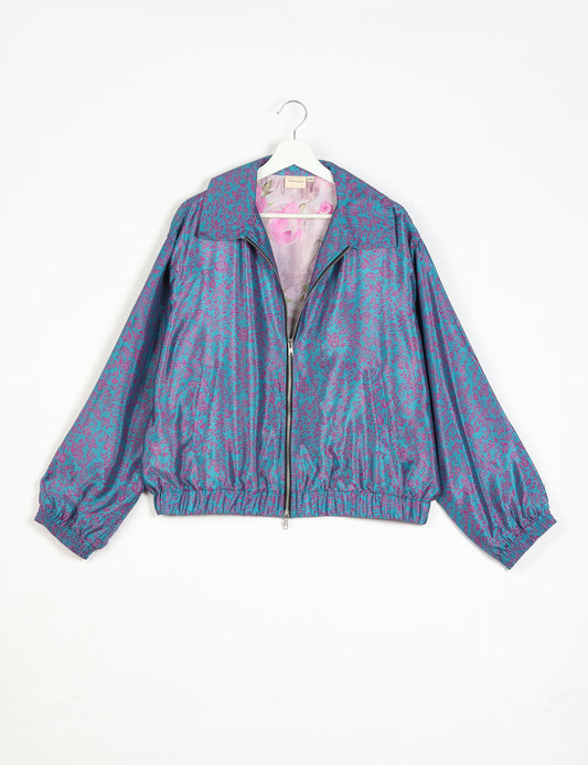 Stylish BOMBER JACKET, an upcycled clothing masterpiece with a cute cropped shape, elasticated details, and detachable metallic zipper. Contrast sari print lining adds a unique touch. Explore sustainable and eco-friendly fashion.