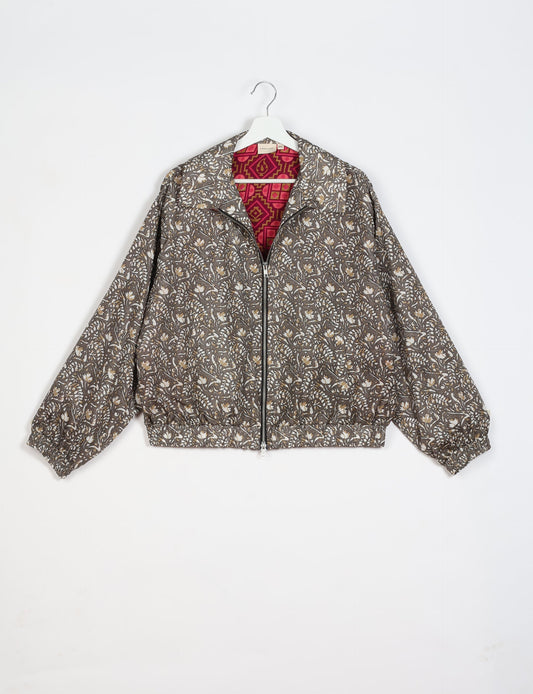 Stylish BOMBER JACKET, an upcycled clothing masterpiece with a cute cropped shape, elasticated details, and detachable metallic zipper. Contrast sari print lining adds a unique touch. Explore sustainable and eco-friendly fashion.