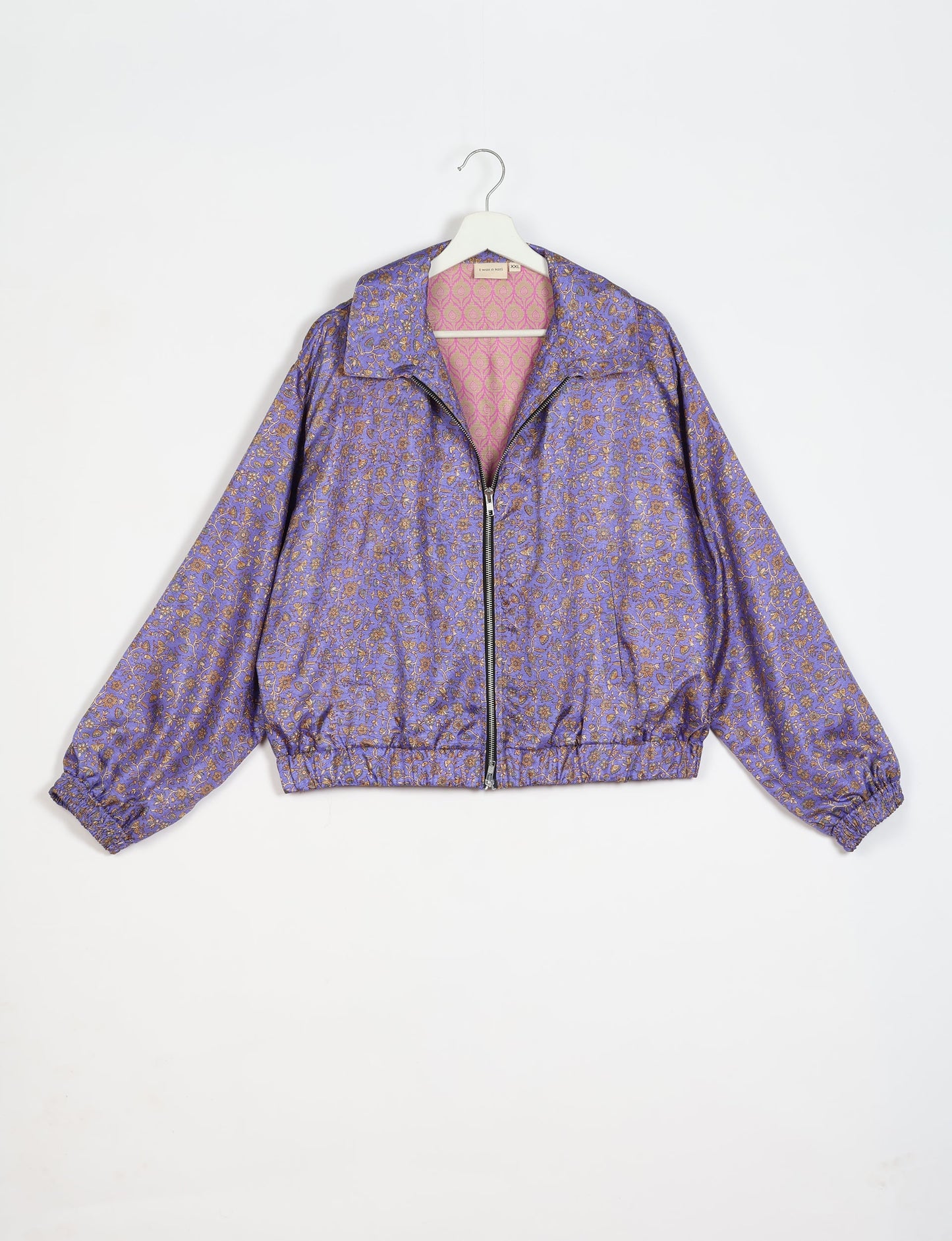 Stylish BOMBER JACKET, an upcycled clothing masterpiece with a cute cropped shape, elasticated details, and detachable metallic zipper. Contrast sari print lining adds a unique touch. Explore sustainable and eco-friendly fashion.