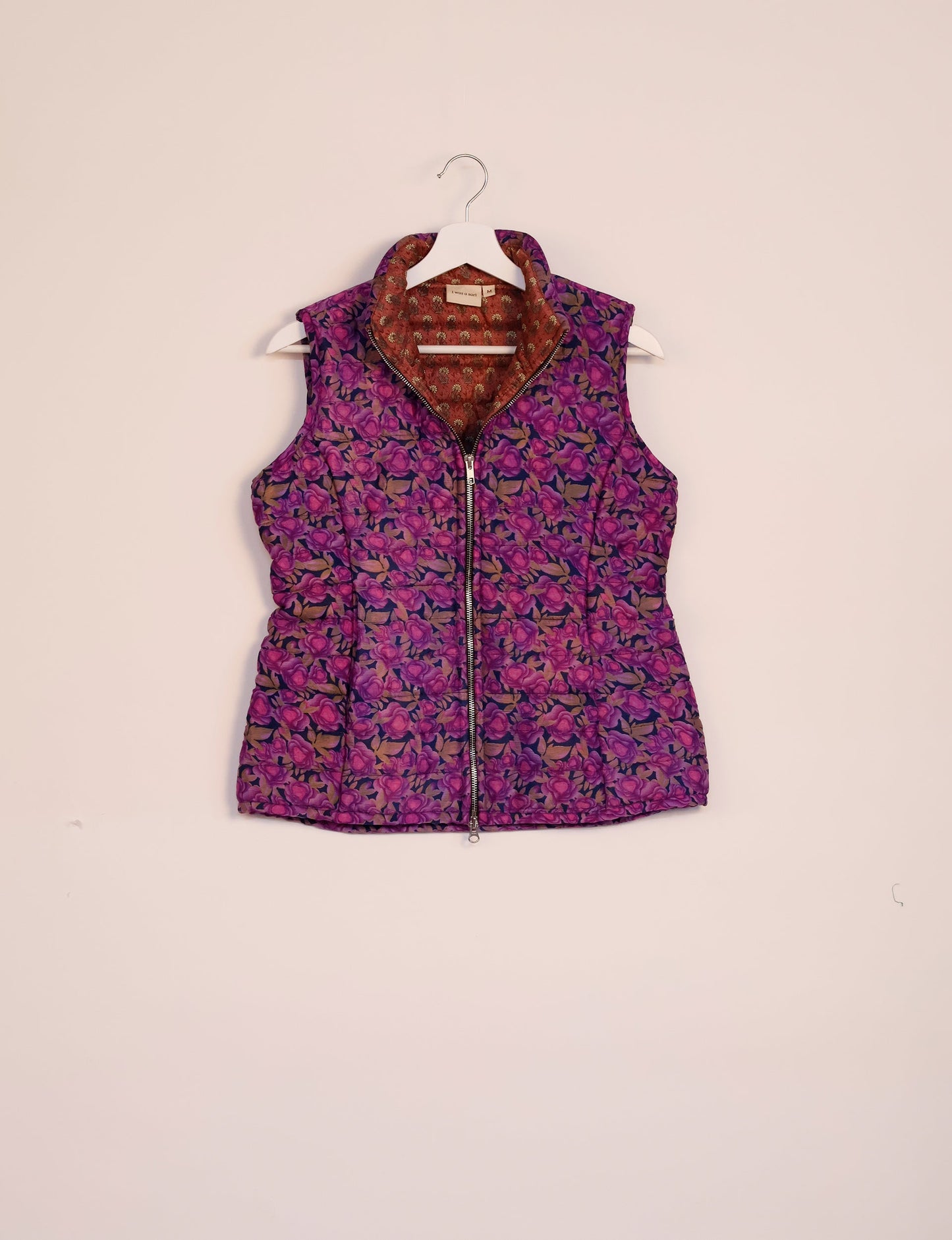 Elevate your style with our QUILTED GILET, crafted from upcycled tropical saris. This sleeveless jacket, with its quilted warmth, is perfect for layering over tees or sweaters. Choose ethical, green fashion and experience the comfort of sustainable living with a touch of home.