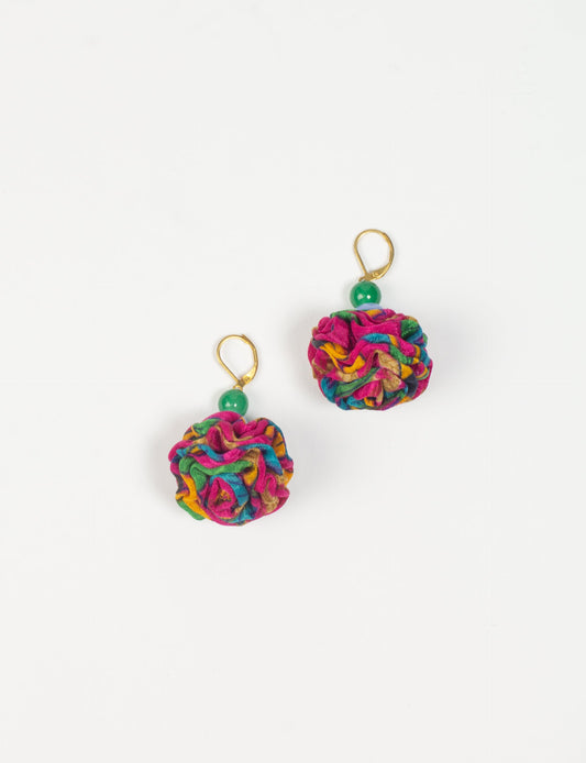 Elevate your style with our Ruffle Earrings, adorned with unique ruffle ball florets crafted from upcycled Indian saris using the traditional Aari embroidery technique. These sustainable earrings feature two glass beads and nickel-free, hypoallergenic metal hooks. Embrace ethical and green fashion with these statement pieces.