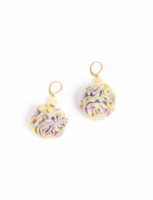 Elevate your style with our Ruffle Earrings, adorned with unique ruffle ball florets crafted from upcycled Indian saris using the traditional Aari embroidery technique. These sustainable earrings feature two glass beads and nickel-free, hypoallergenic metal hooks. Embrace ethical and green fashion with these statement pieces.