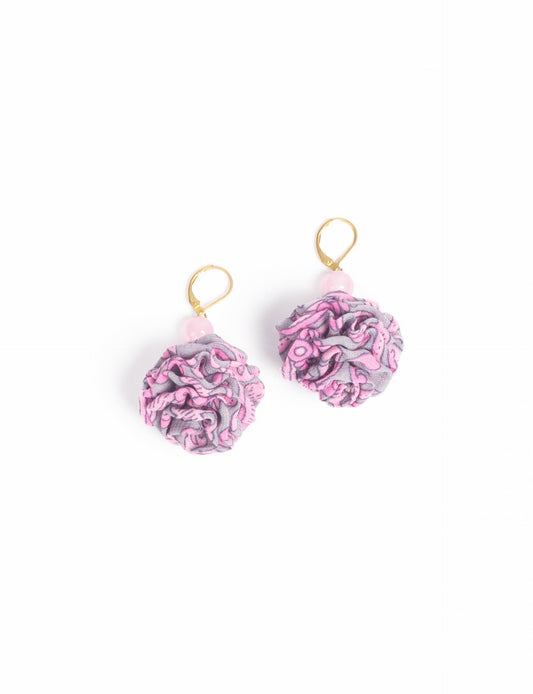 Elevate your style with our Ruffle Earrings, adorned with unique ruffle ball florets crafted from upcycled Indian saris using the traditional Aari embroidery technique. These sustainable earrings feature two glass beads and nickel-free, hypoallergenic metal hooks. Embrace ethical and green fashion with these statement pieces.