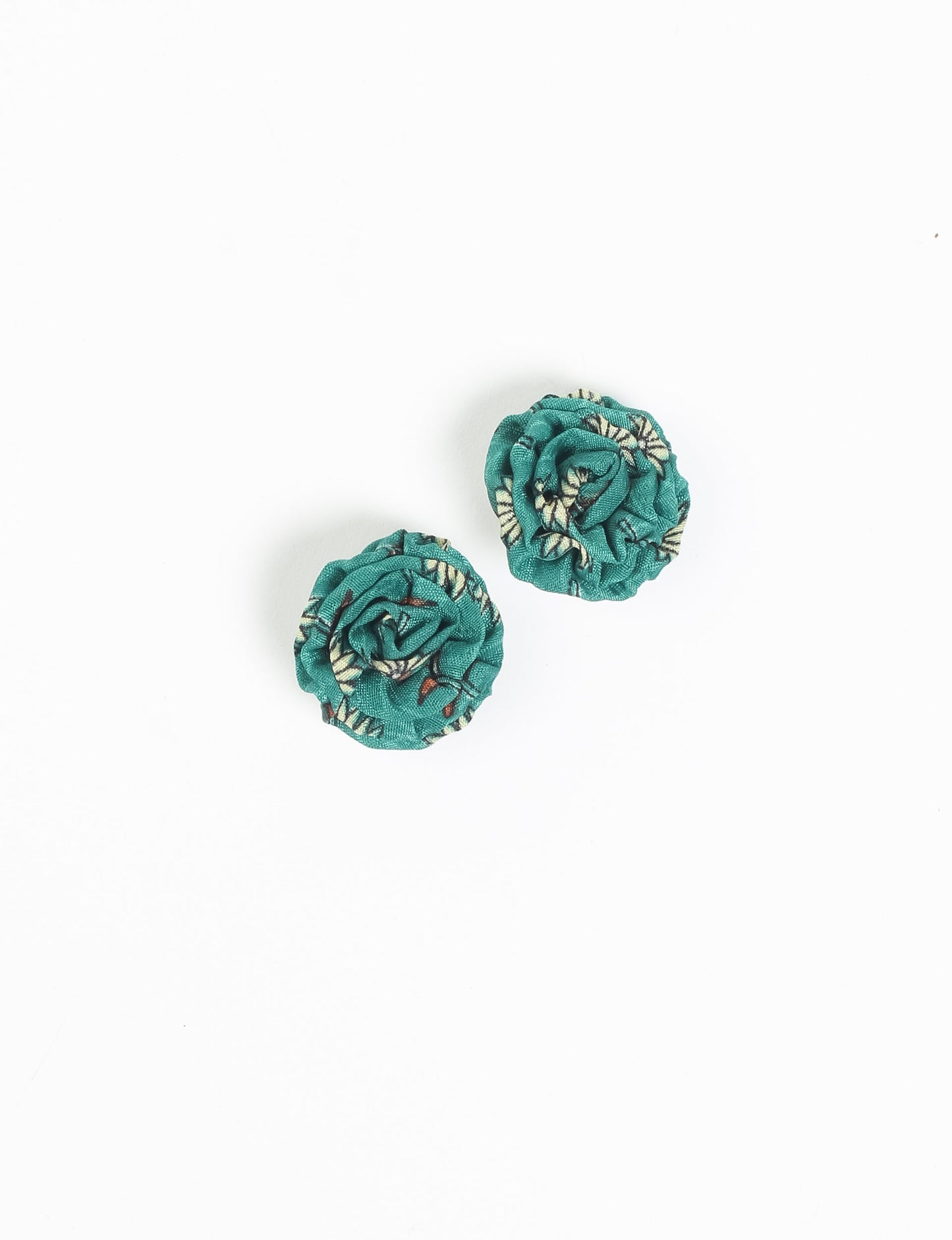 Elevate your elegance with Ruffle Earrings, delicate fabric studs showcasing Indian Aari embroidery. These eco-friendly earrings feature intricate floral patterns, embodying ethical and green fashion. Hypoallergenic and skin-friendly, our studs make a stylish statement in sustainable accessorizing."




