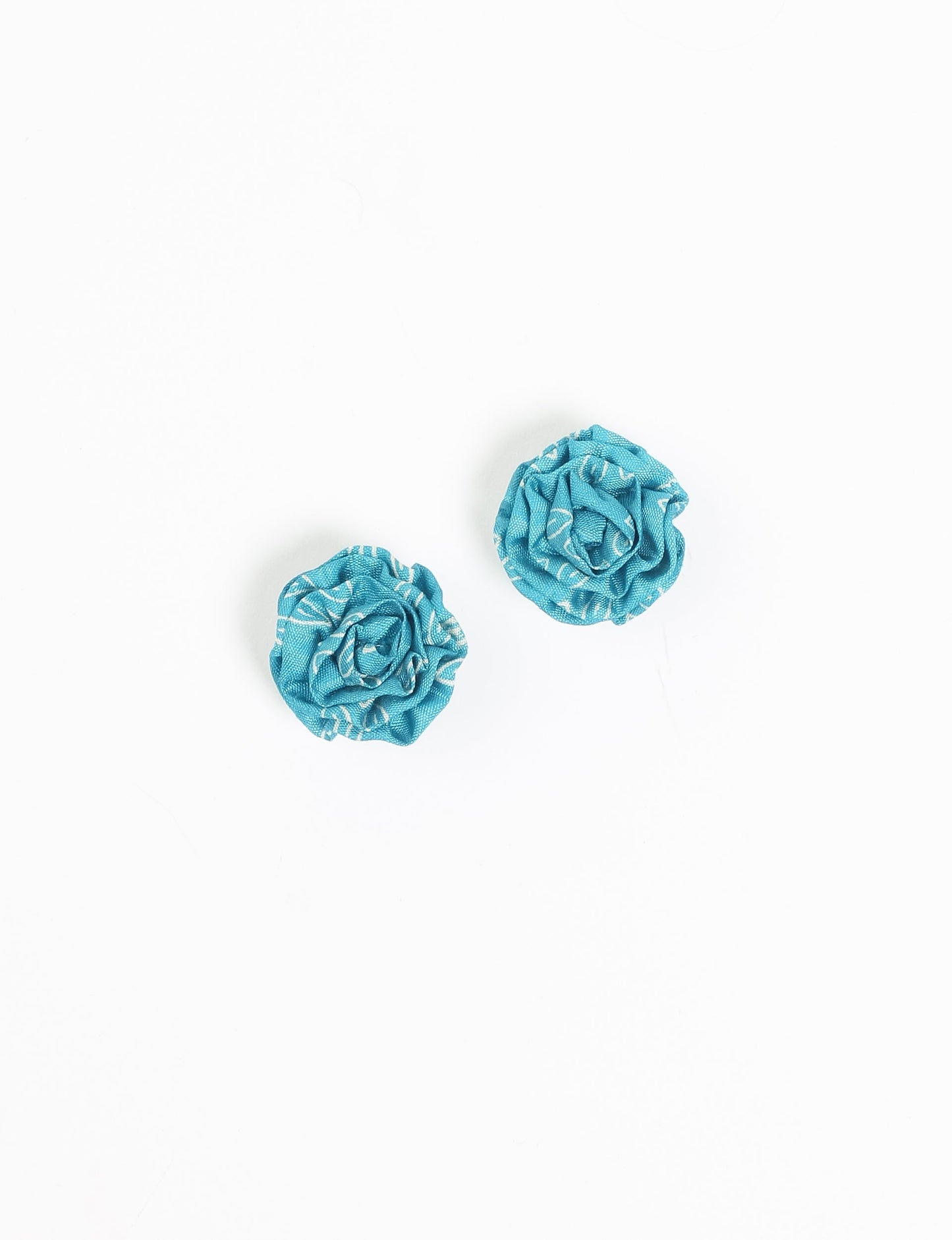 Elevate your elegance with Ruffle Earrings, delicate fabric studs showcasing Indian Aari embroidery. These eco-friendly earrings feature intricate floral patterns, embodying ethical and green fashion. Hypoallergenic and skin-friendly, our studs make a stylish statement in sustainable accessorizing."




