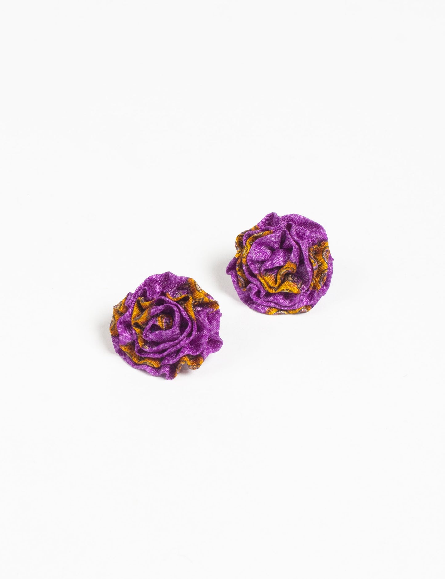 Elevate your elegance with Ruffle Earrings, delicate fabric studs showcasing Indian Aari embroidery. These eco-friendly earrings feature intricate floral patterns, embodying ethical and green fashion. Hypoallergenic and skin-friendly, our studs make a stylish statement in sustainable accessorizing."




