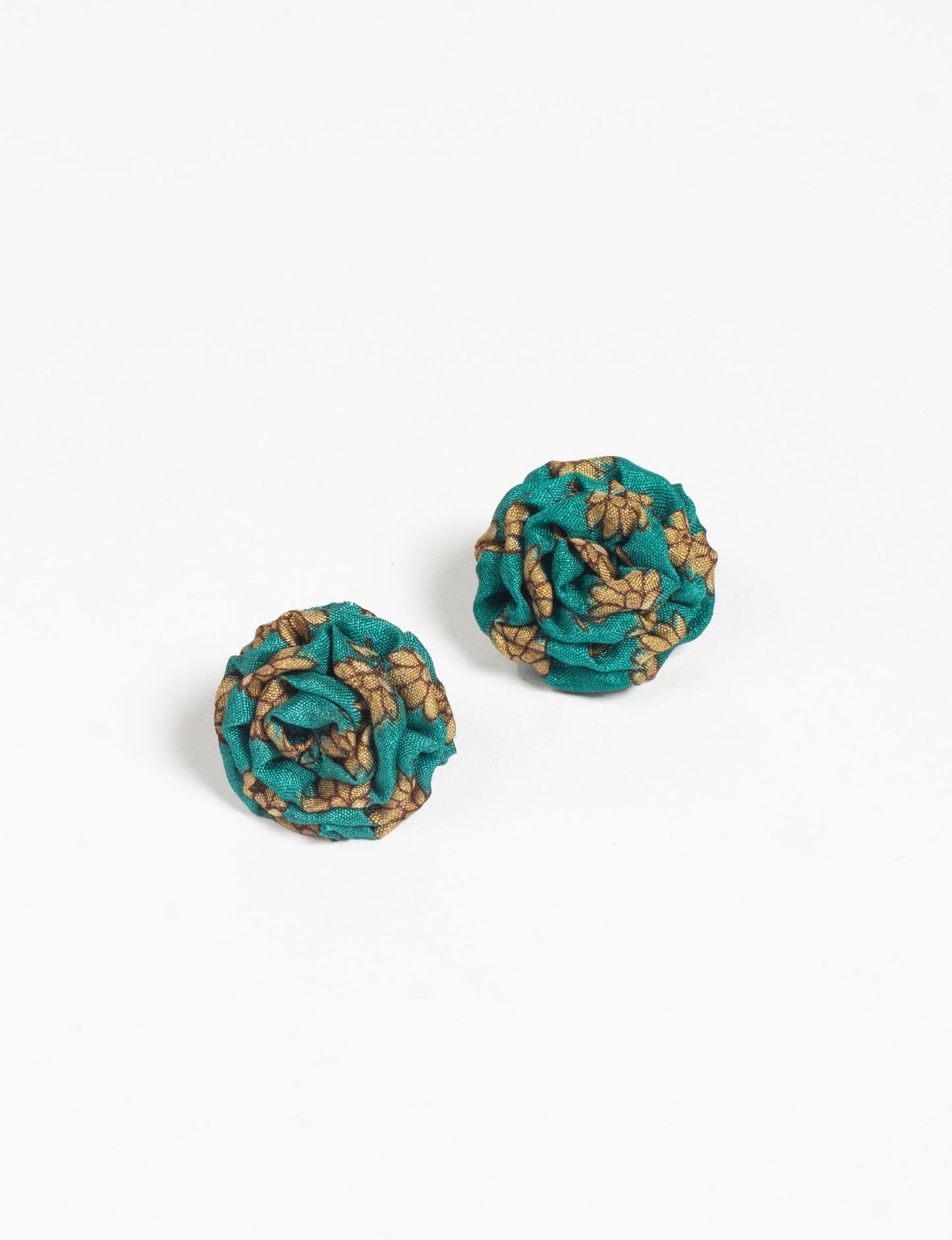 Elevate your elegance with Ruffle Earrings, delicate fabric studs showcasing Indian Aari embroidery. These eco-friendly earrings feature intricate floral patterns, embodying ethical and green fashion. Hypoallergenic and skin-friendly, our studs make a stylish statement in sustainable accessorizing."




