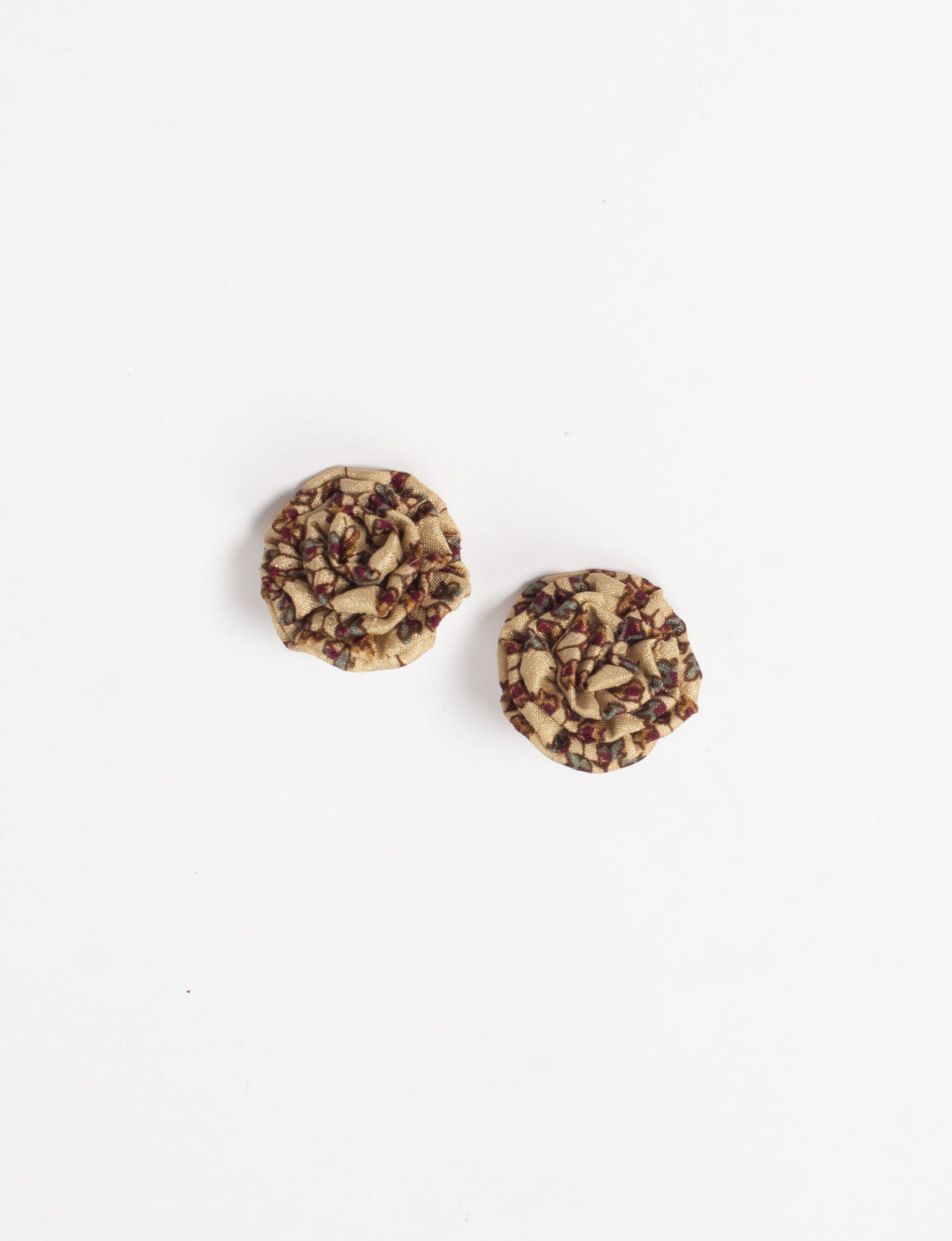Beige fabric ruffle earrings with micro floral pattern in red, green, and brown, shown flat on white background