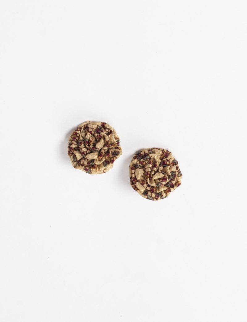 Beige fabric ruffle earrings with micro floral pattern in red, green, and brown, shown flat on white background