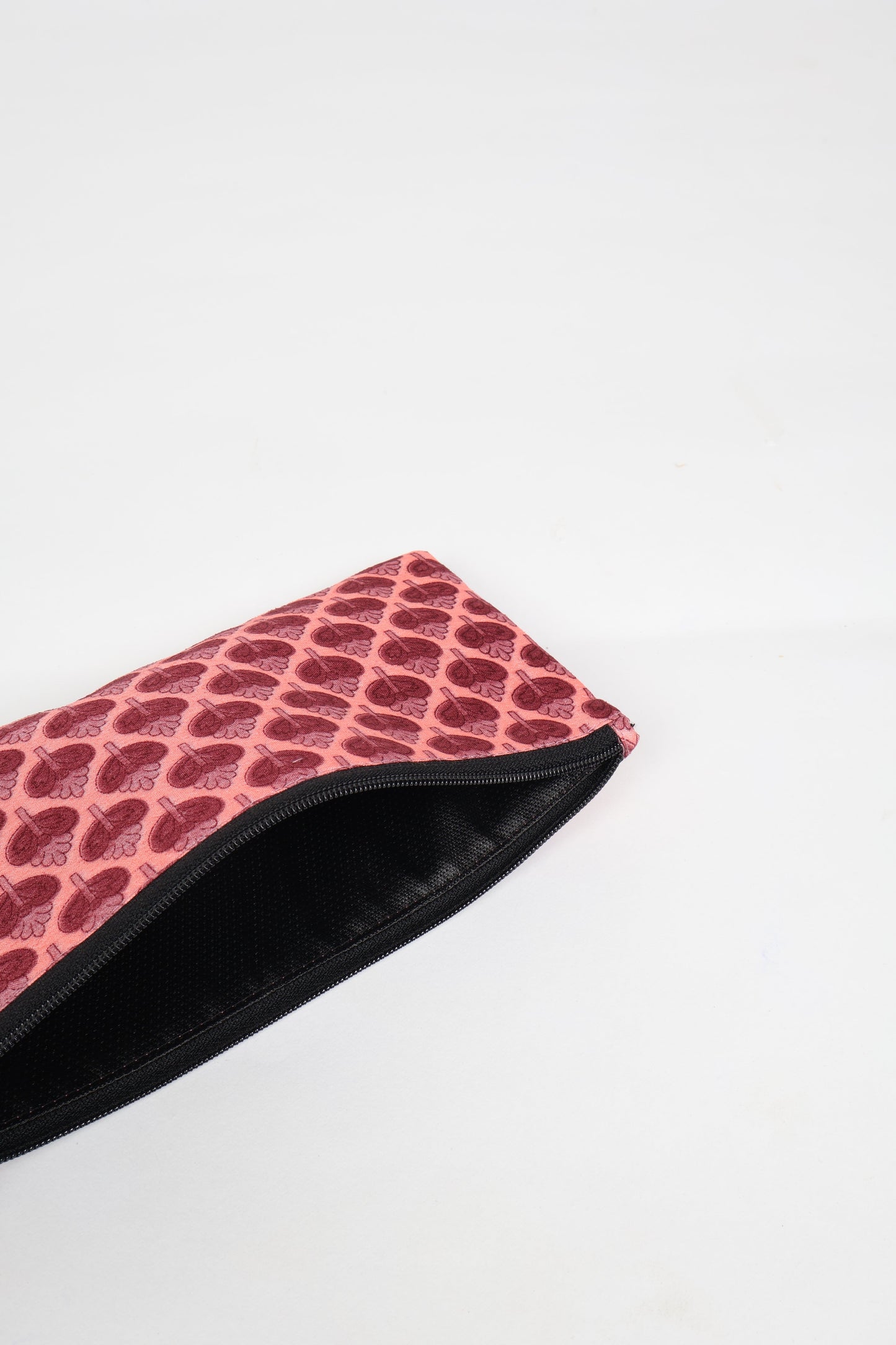 Eco-conscious quilted pencil pouch with waterproof lining made from upcycled garments, reflecting the values of circular fashion, carbon neutral fashion, and repurposed clothing. A perfect example of green fashion and sustainable women's clothing.