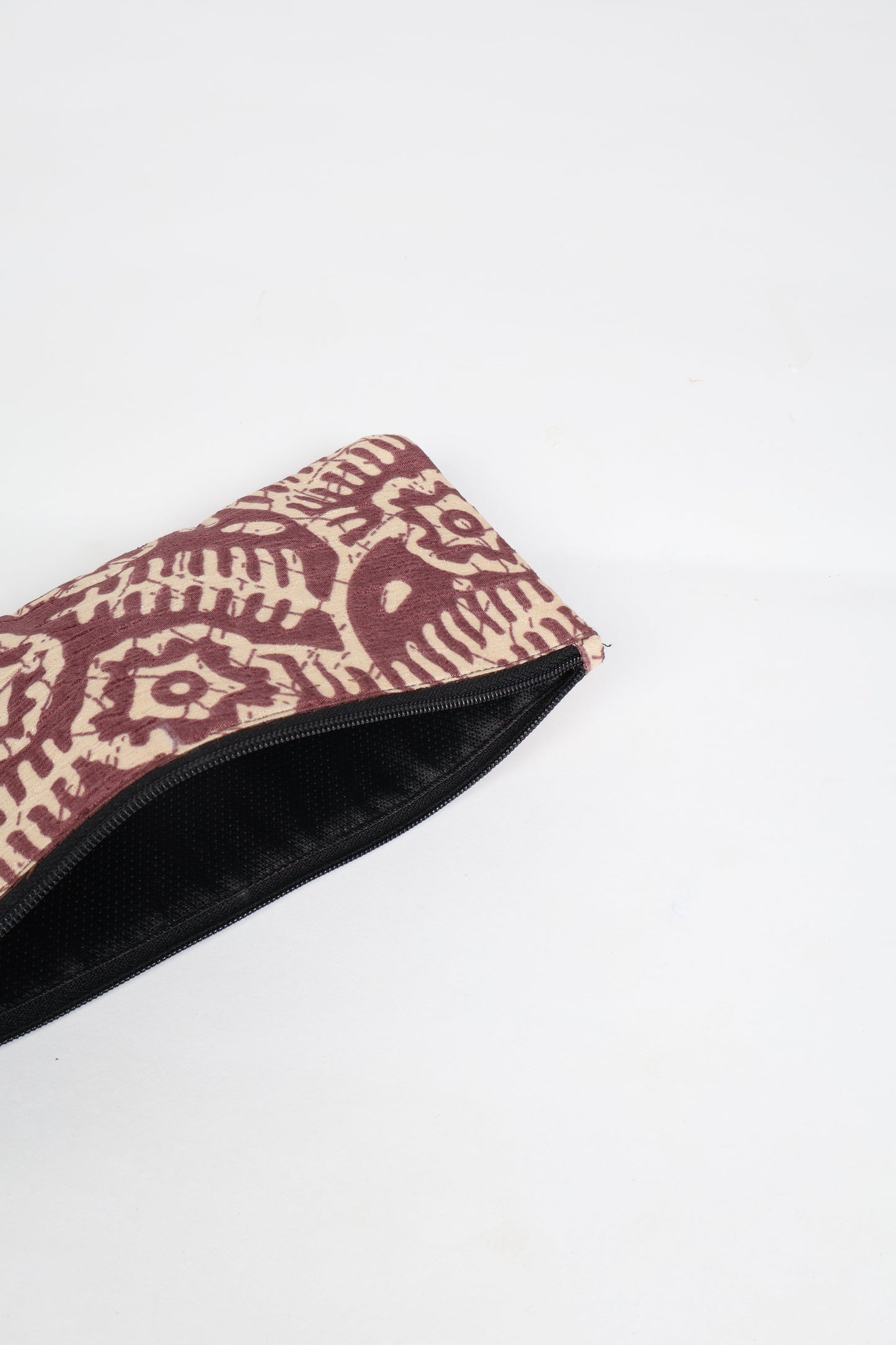 Eco-conscious quilted pencil pouch with waterproof lining made from upcycled garments, reflecting the values of circular fashion, carbon neutral fashion, and repurposed clothing. A perfect example of green fashion and sustainable women's clothing.