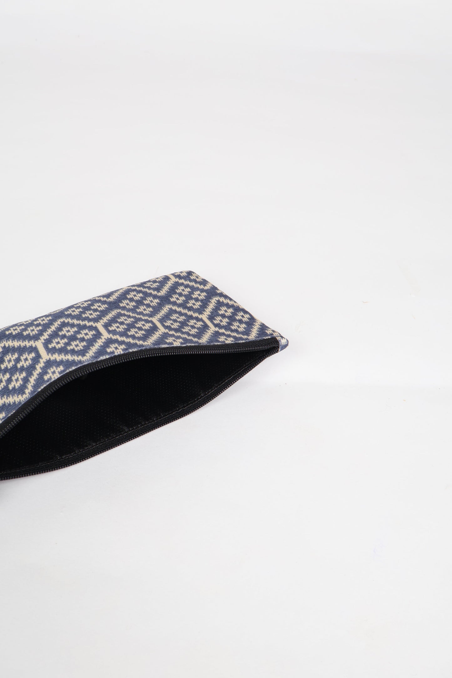 Eco-conscious quilted pencil pouch with waterproof lining made from upcycled garments, reflecting the values of circular fashion, carbon neutral fashion, and repurposed clothing. A perfect example of green fashion and sustainable women's clothing.