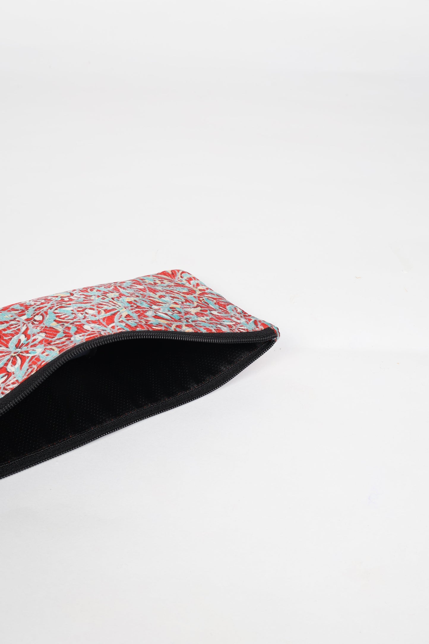 Eco-conscious quilted pencil pouch with waterproof lining made from upcycled garments, reflecting the values of circular fashion, carbon neutral fashion, and repurposed clothing. A perfect example of green fashion and sustainable women's clothing.