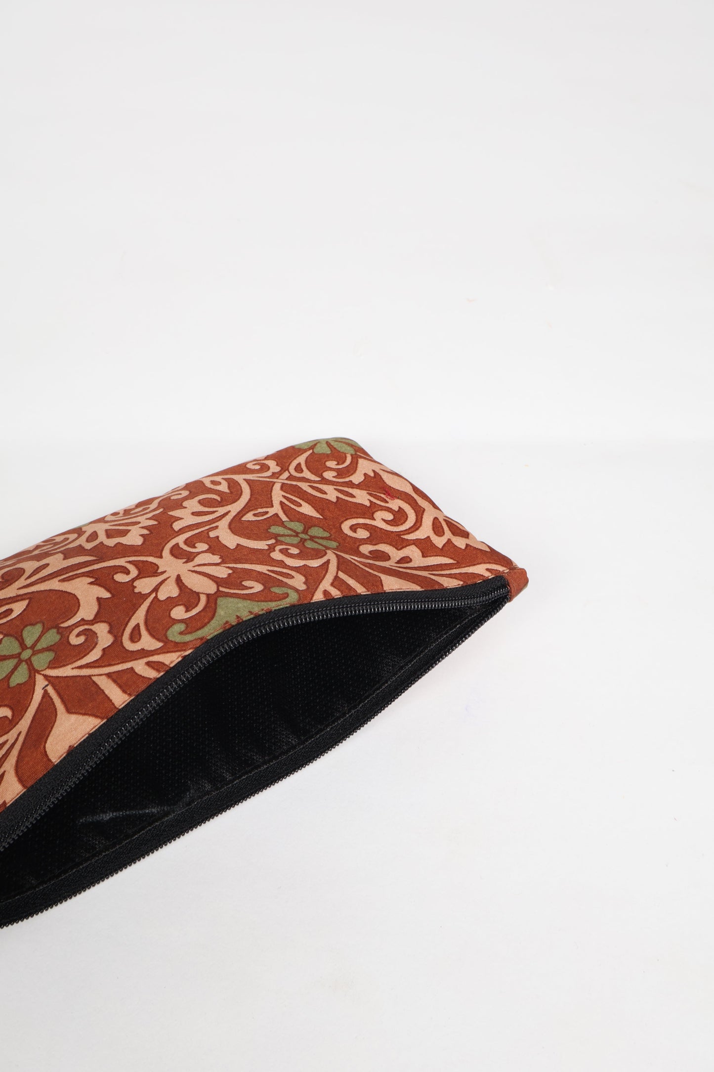 Eco-conscious quilted pencil pouch with waterproof lining made from upcycled garments, reflecting the values of circular fashion, carbon neutral fashion, and repurposed clothing. A perfect example of green fashion and sustainable women's clothing.