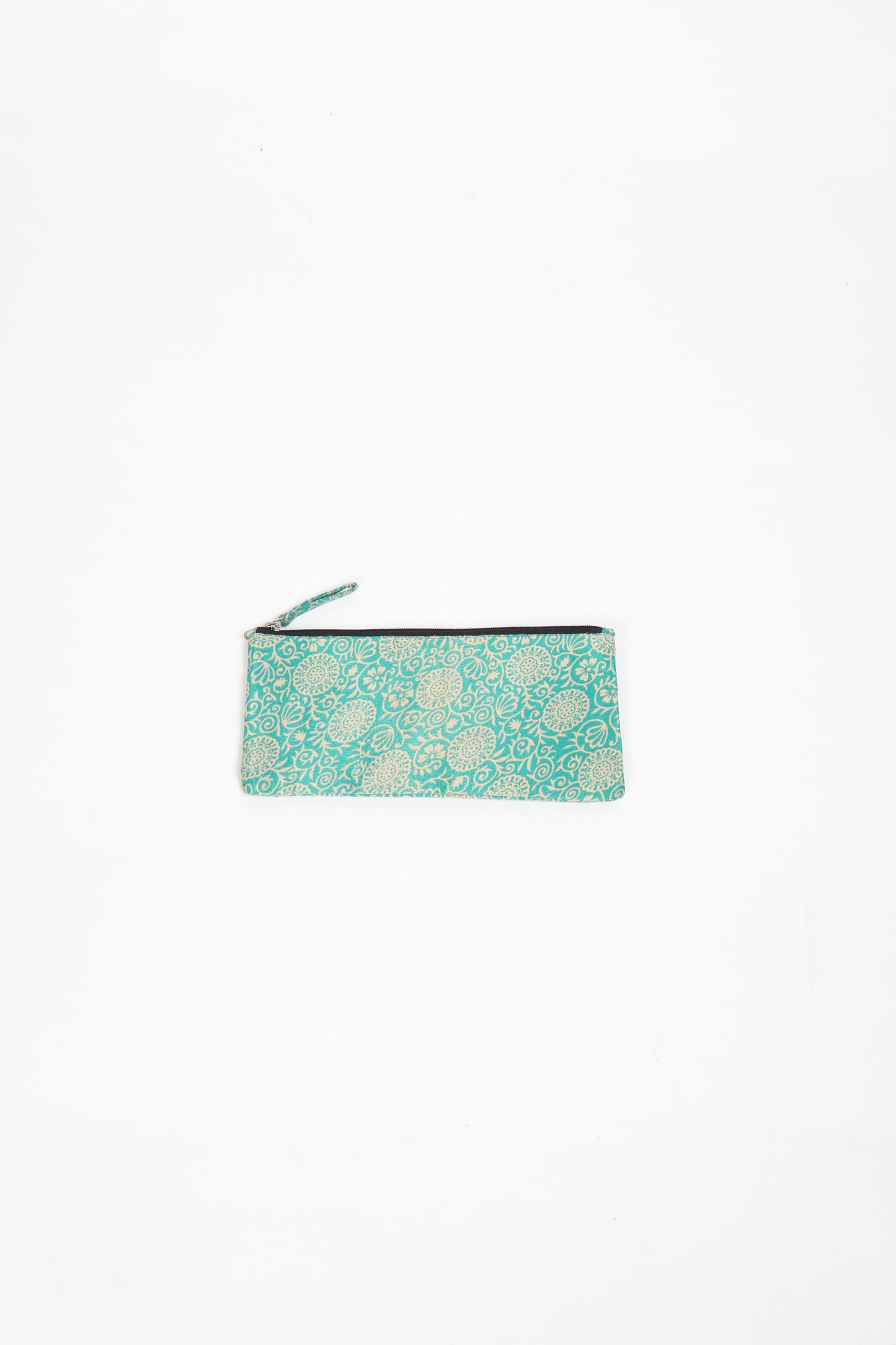 Eco-conscious quilted pencil pouch with waterproof lining made from upcycled garments, reflecting the values of circular fashion, carbon neutral fashion, and repurposed clothing. A perfect example of green fashion and sustainable women's clothing.