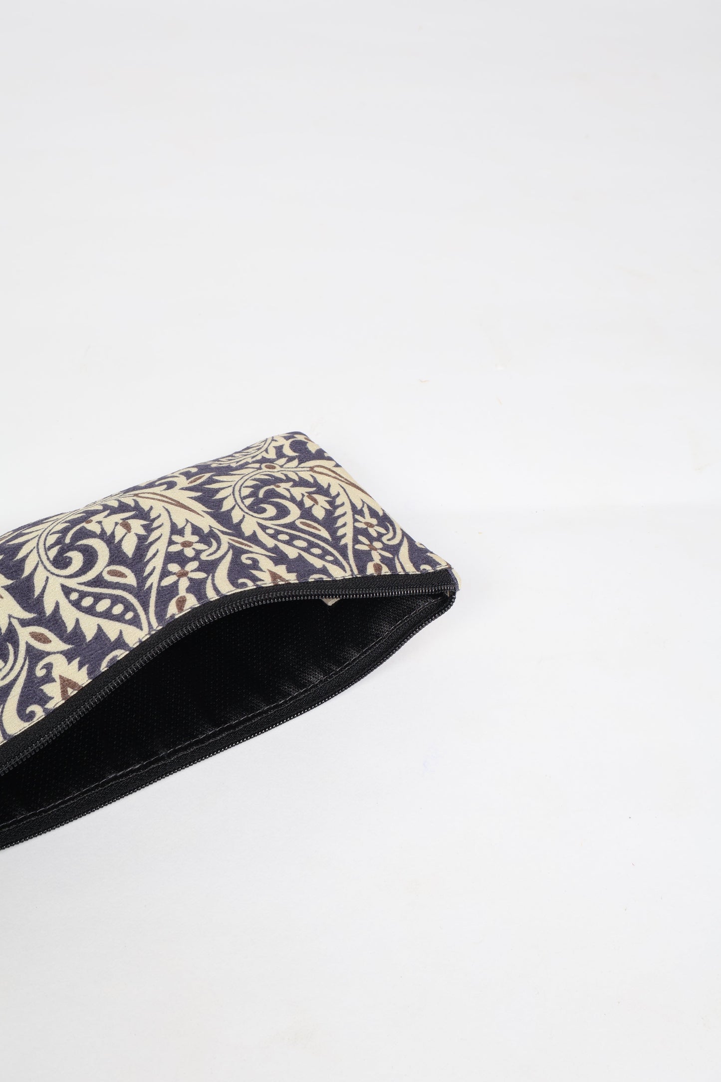 Eco-conscious quilted pencil pouch with waterproof lining made from upcycled garments, reflecting the values of circular fashion, carbon neutral fashion, and repurposed clothing. A perfect example of green fashion and sustainable women's clothing.