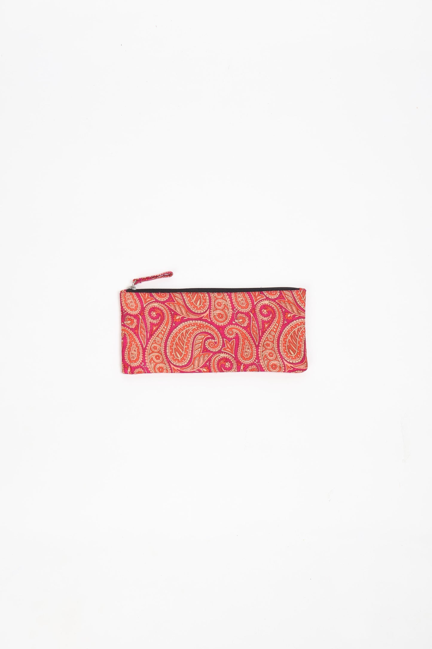 Eco-conscious quilted pencil pouch with waterproof lining made from upcycled garments, reflecting the values of circular fashion, carbon neutral fashion, and repurposed clothing. A perfect example of green fashion and sustainable women's clothing.