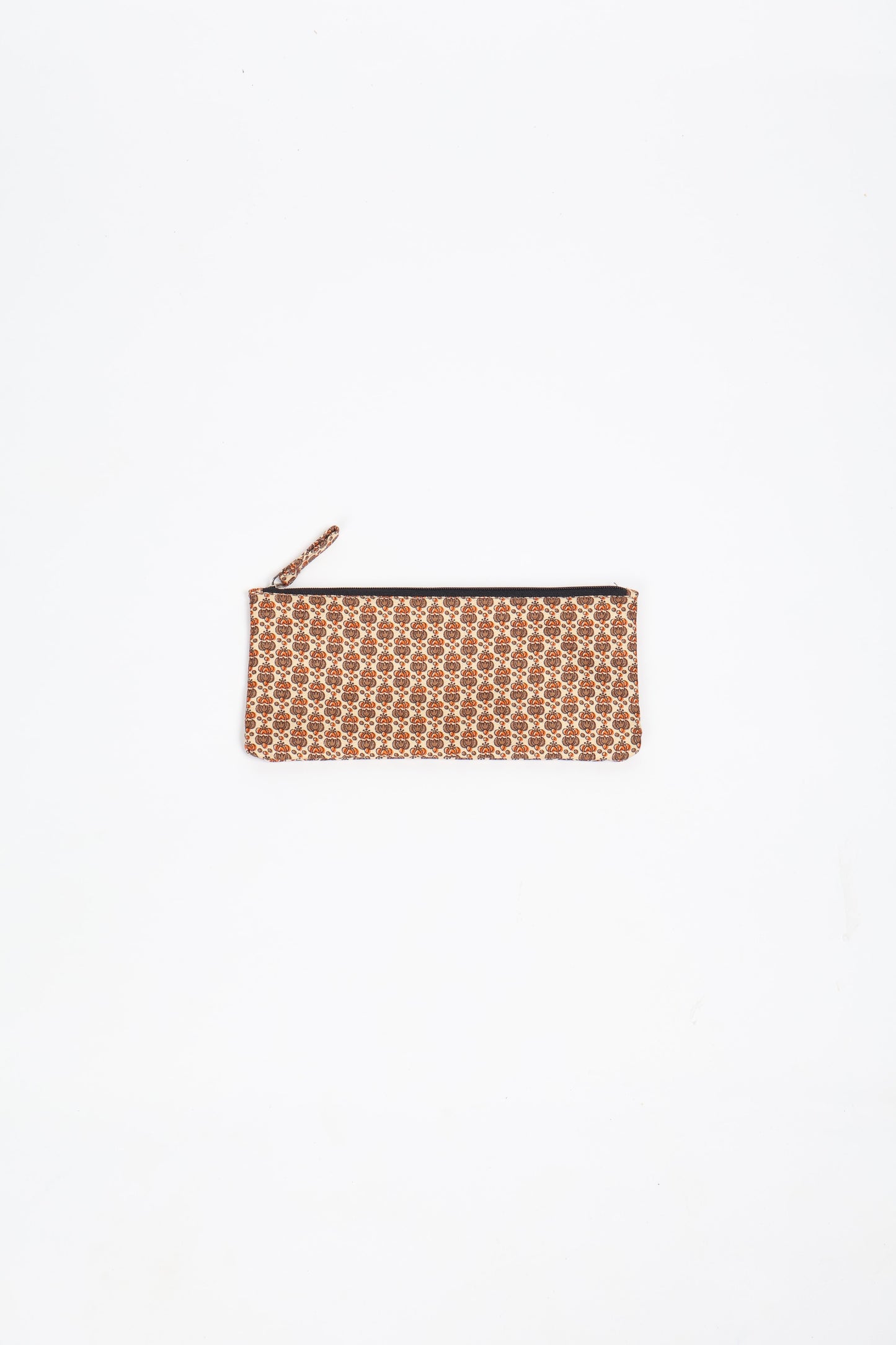 Eco-conscious quilted pencil pouch with waterproof lining made from upcycled garments, reflecting the values of circular fashion, carbon neutral fashion, and repurposed clothing. A perfect example of green fashion and sustainable women's clothing.