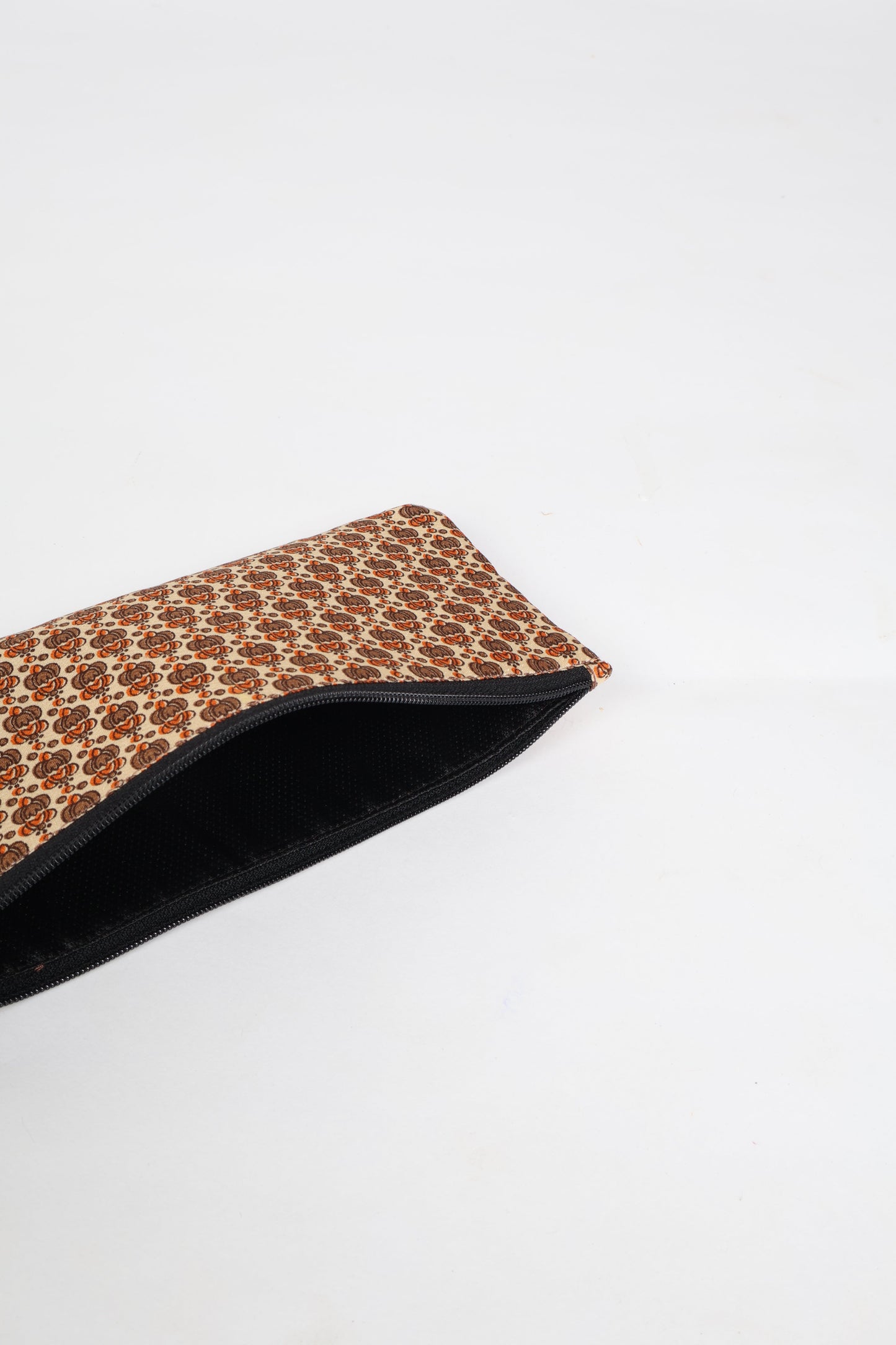 Eco-conscious quilted pencil pouch with waterproof lining made from upcycled garments, reflecting the values of circular fashion, carbon neutral fashion, and repurposed clothing. A perfect example of green fashion and sustainable women's clothing.