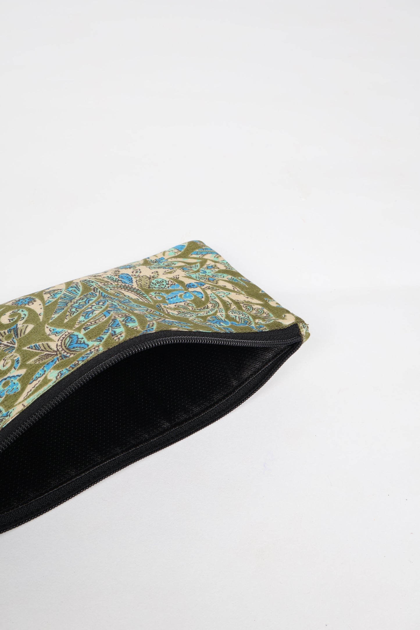 Eco-conscious quilted pencil pouch with waterproof lining made from upcycled garments, reflecting the values of circular fashion, carbon neutral fashion, and repurposed clothing. A perfect example of green fashion and sustainable women's clothing.