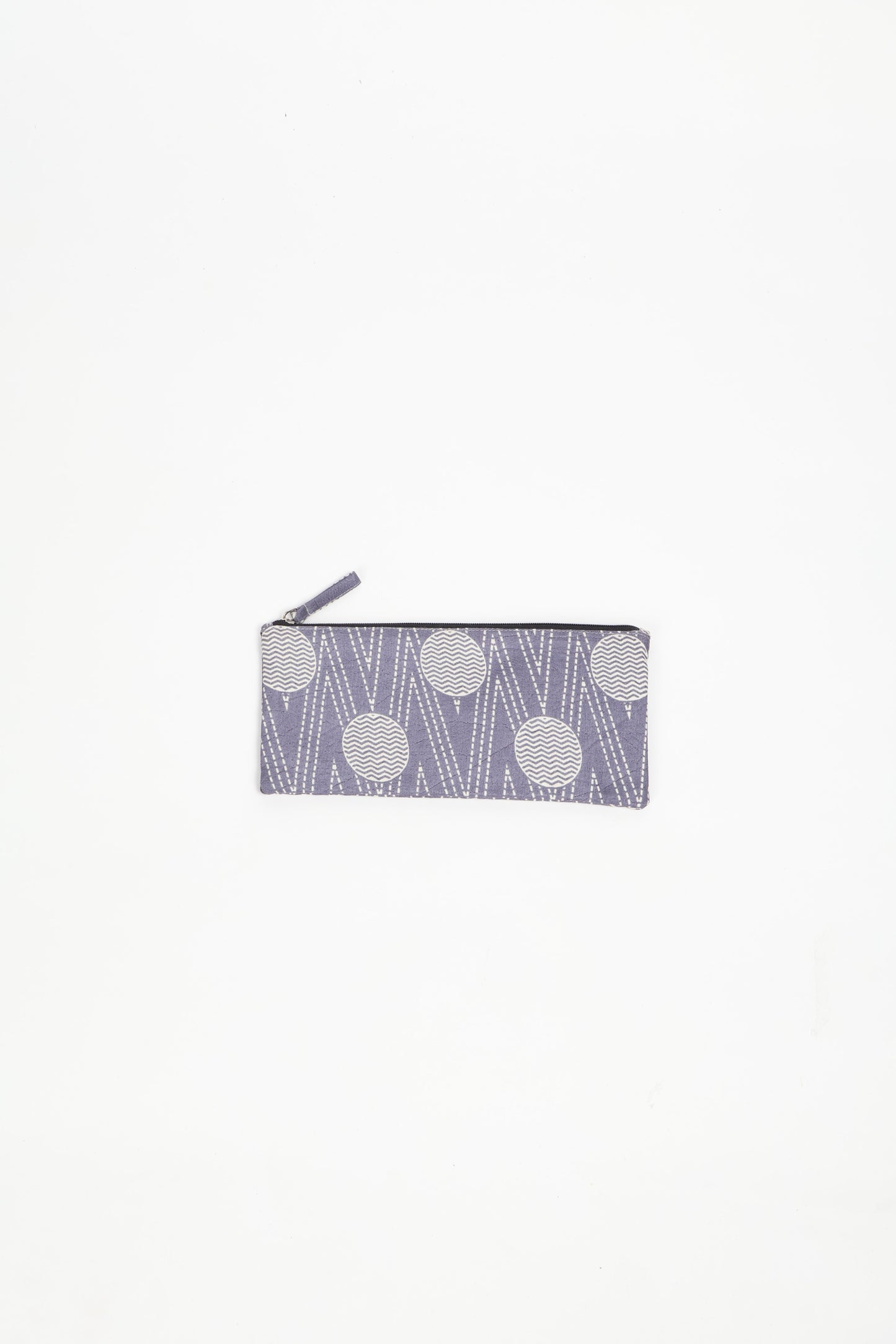Eco-conscious quilted pencil pouch with waterproof lining made from upcycled garments, reflecting the values of circular fashion, carbon neutral fashion, and repurposed clothing. A perfect example of green fashion and sustainable women's clothing.
