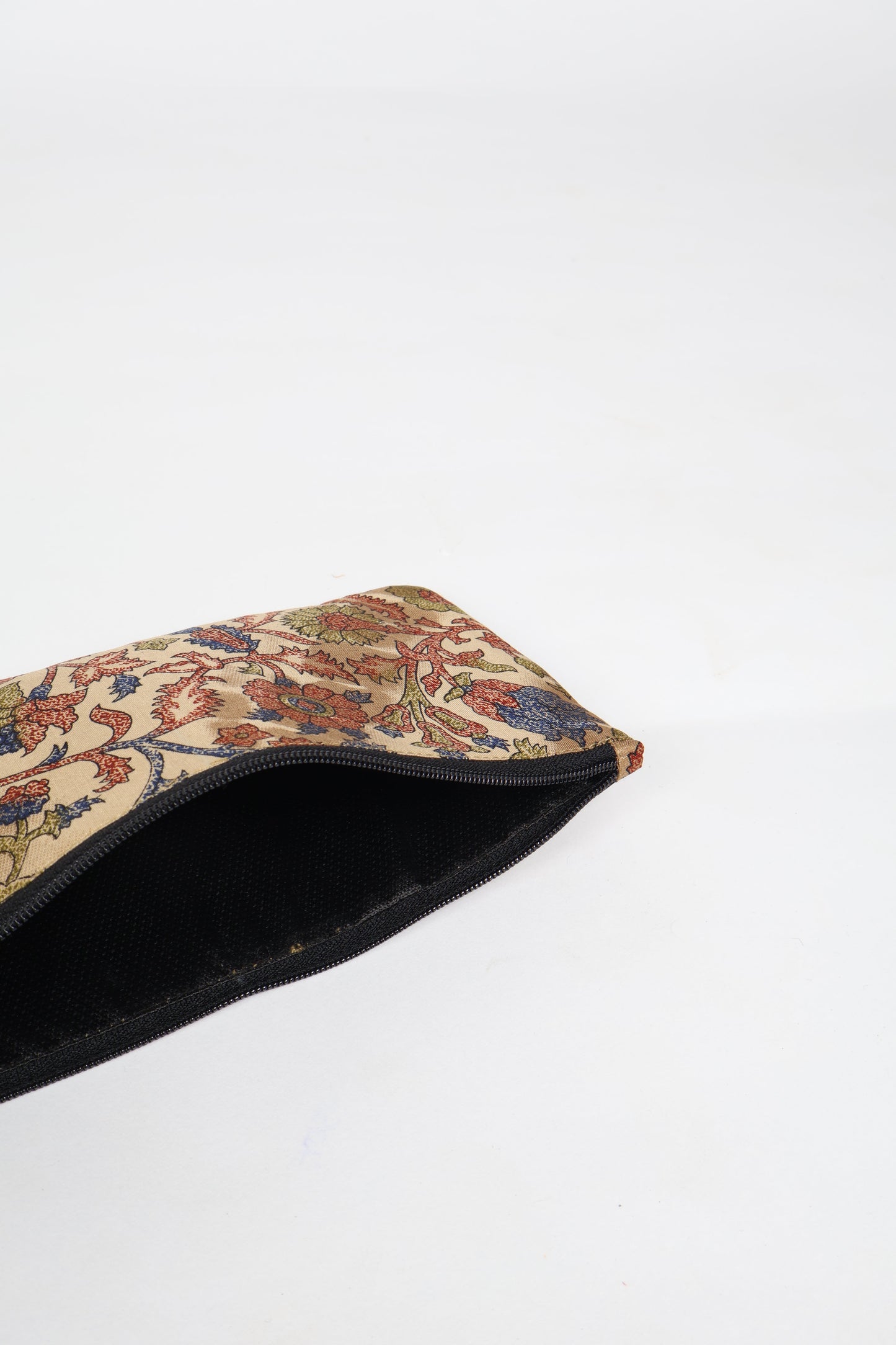 Eco-conscious quilted pencil pouch with waterproof lining made from upcycled garments, reflecting the values of circular fashion, carbon neutral fashion, and repurposed clothing. A perfect example of green fashion and sustainable women's clothing.