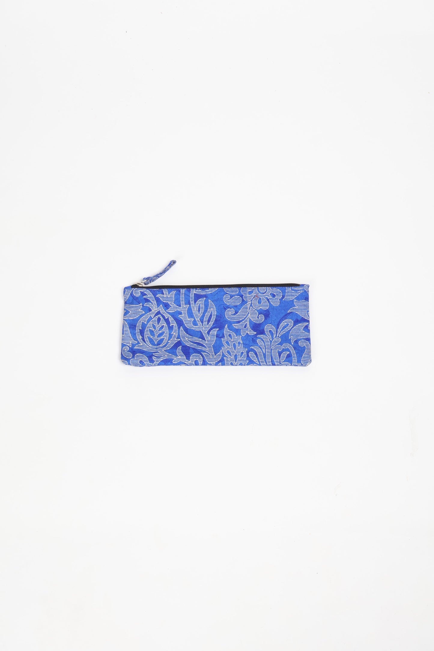 Eco-conscious quilted pencil pouch with waterproof lining made from upcycled garments, reflecting the values of circular fashion, carbon neutral fashion, and repurposed clothing. A perfect example of green fashion and sustainable women's clothing.