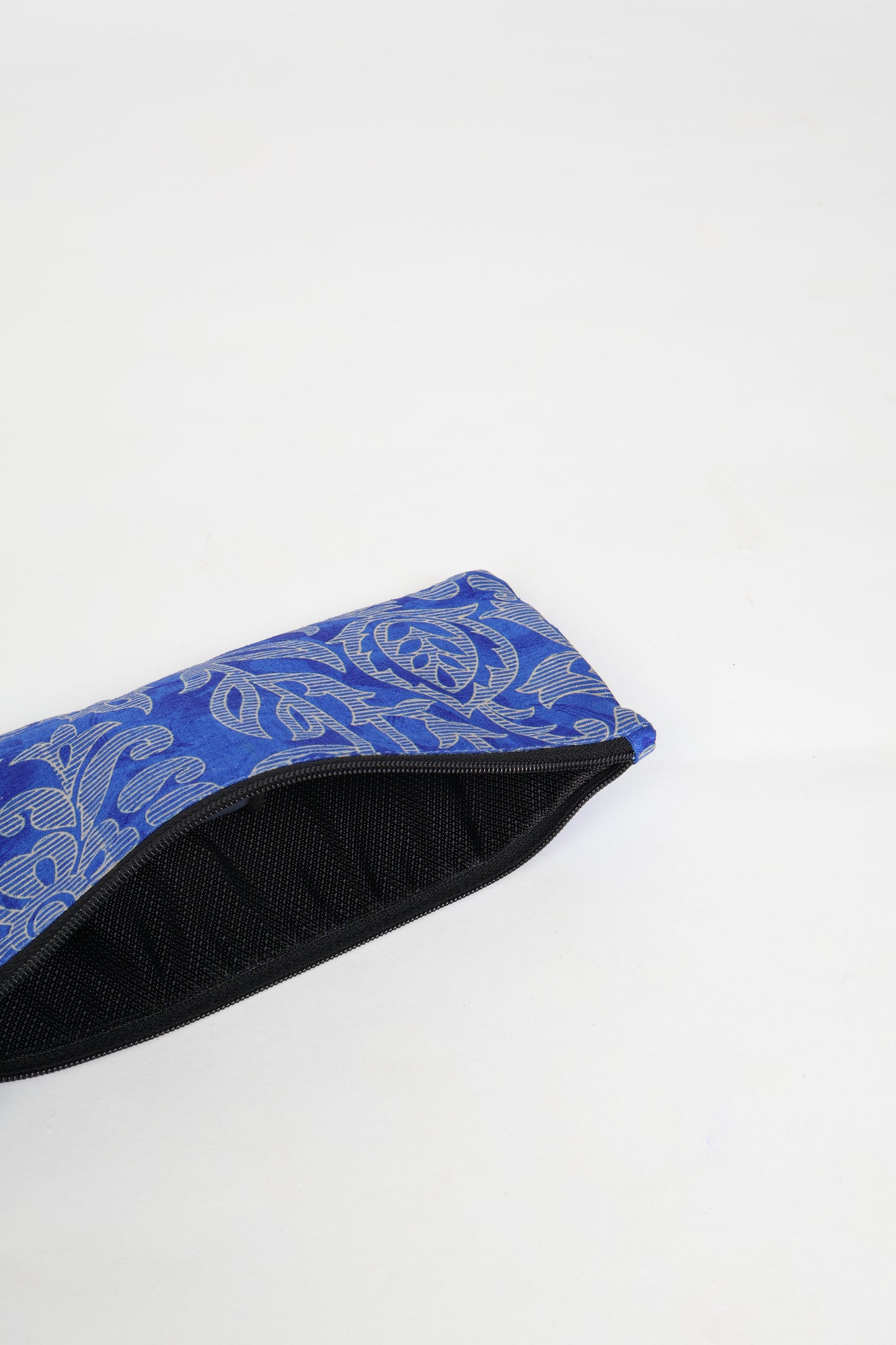 Eco-conscious quilted pencil pouch with waterproof lining made from upcycled garments, reflecting the values of circular fashion, carbon neutral fashion, and repurposed clothing. A perfect example of green fashion and sustainable women's clothing.