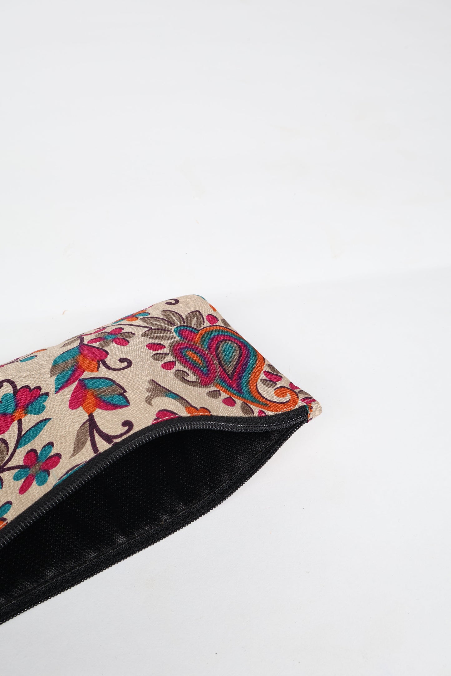 Eco-conscious quilted pencil pouch with waterproof lining made from upcycled garments, reflecting the values of circular fashion, carbon neutral fashion, and repurposed clothing. A perfect example of green fashion and sustainable women's clothing.