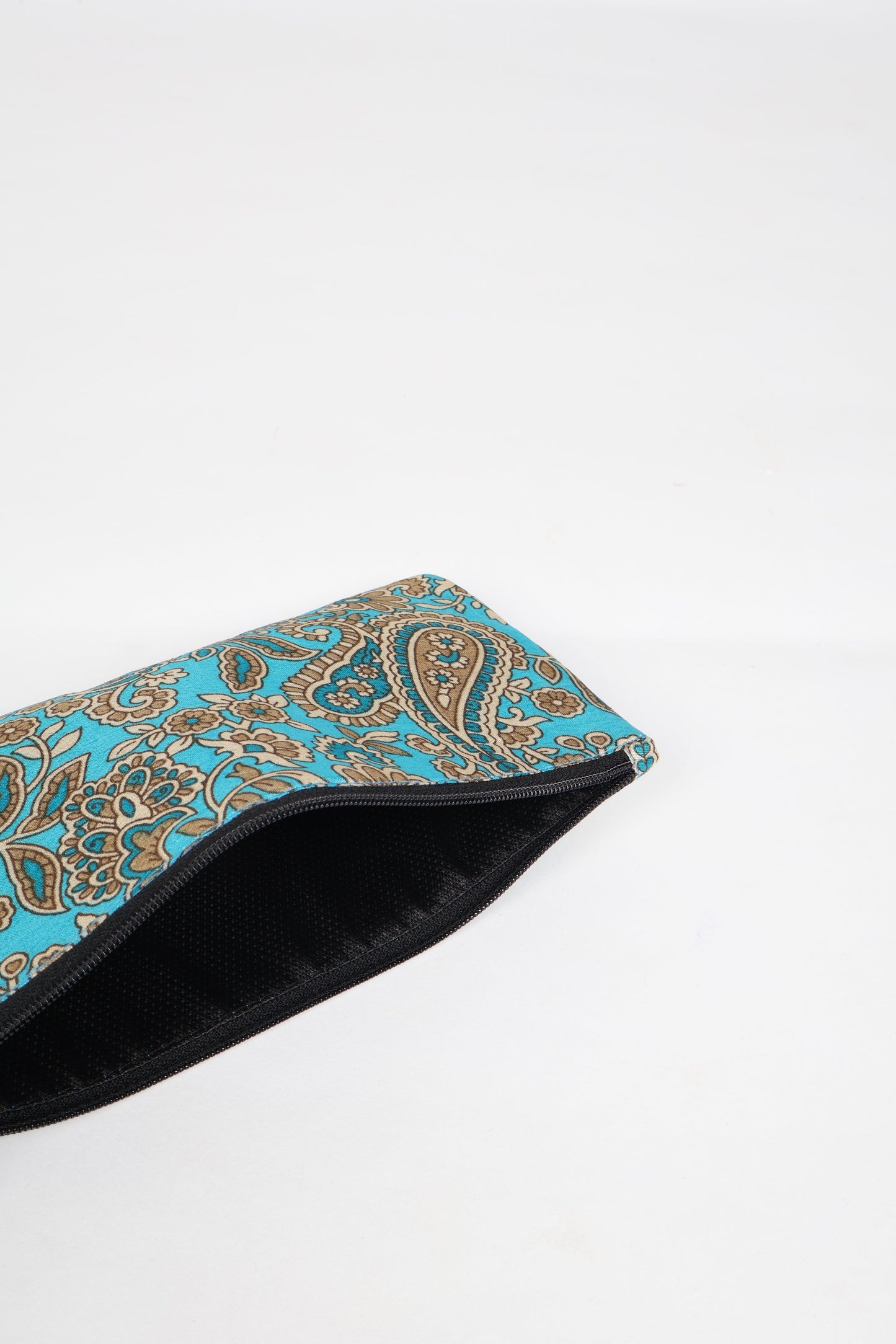 Eco-conscious quilted pencil pouch with waterproof lining made from upcycled garments, reflecting the values of circular fashion, carbon neutral fashion, and repurposed clothing. A perfect example of green fashion and sustainable women's clothing.