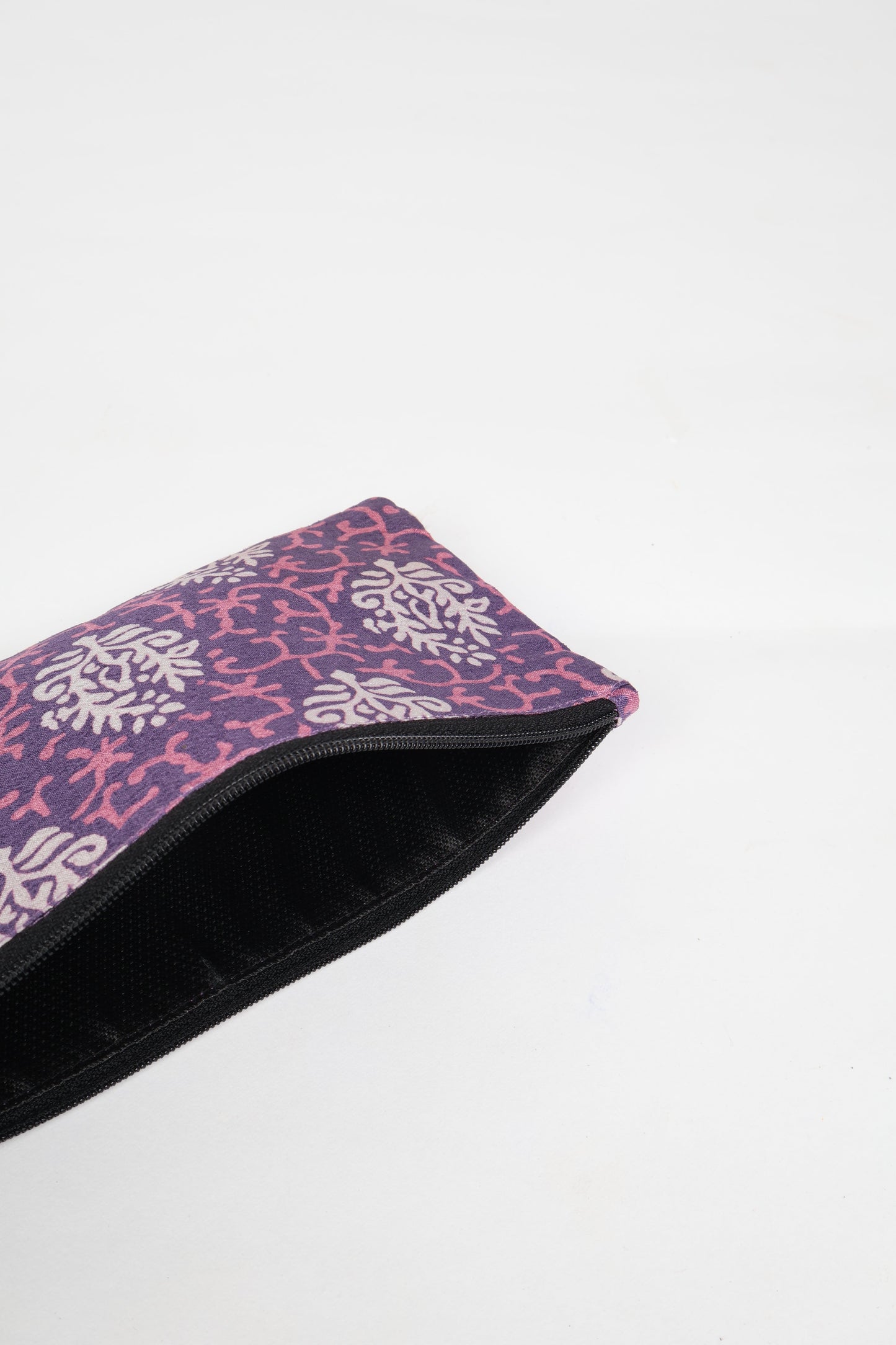 Eco-conscious quilted pencil pouch with waterproof lining made from upcycled garments, reflecting the values of circular fashion, carbon neutral fashion, and repurposed clothing. A perfect example of green fashion and sustainable women's clothing.
