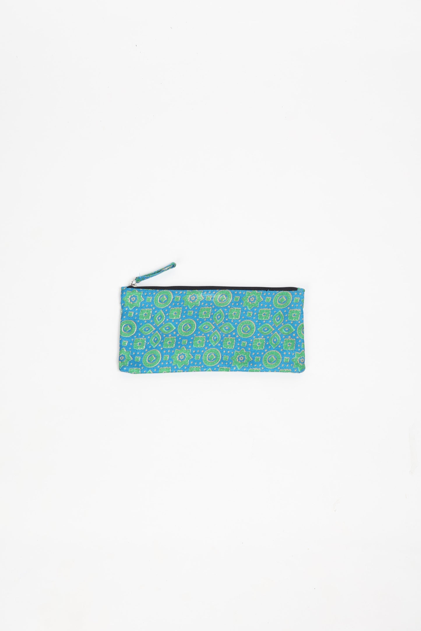 Eco-conscious quilted pencil pouch with waterproof lining made from upcycled garments, reflecting the values of circular fashion, carbon neutral fashion, and repurposed clothing. A perfect example of green fashion and sustainable women's clothing.