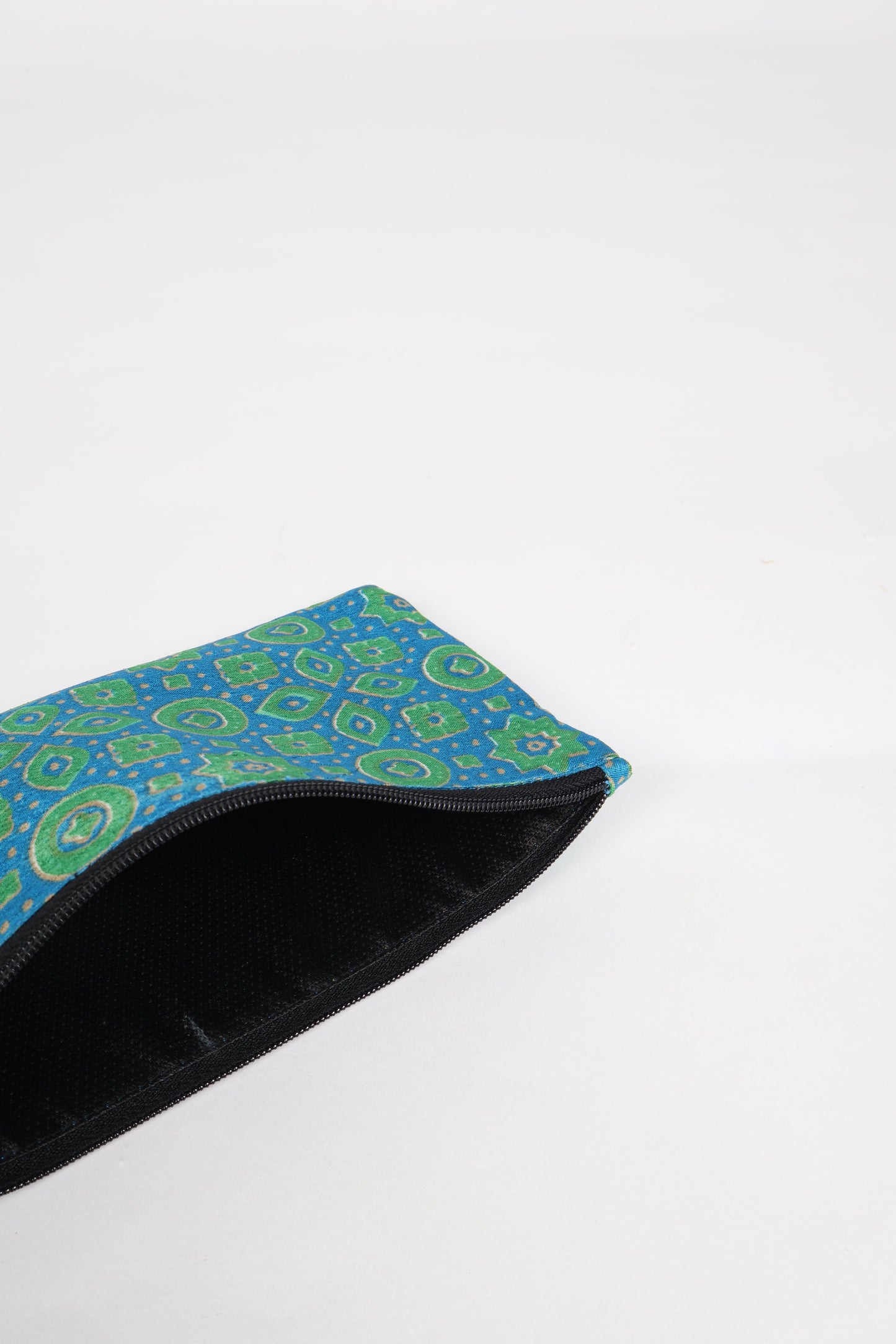 Eco-conscious quilted pencil pouch with waterproof lining made from upcycled garments, reflecting the values of circular fashion, carbon neutral fashion, and repurposed clothing. A perfect example of green fashion and sustainable women's clothing.